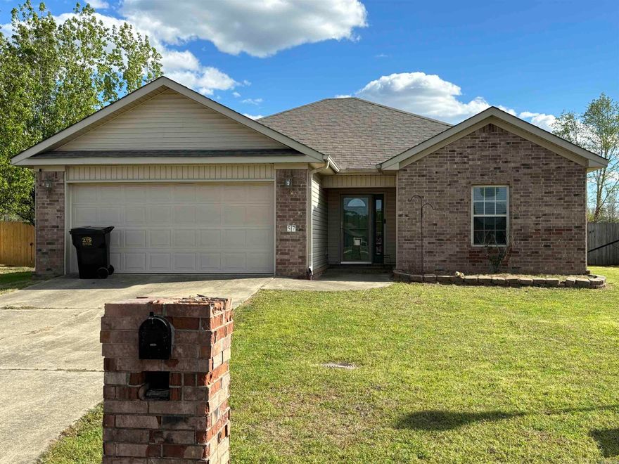 Adorable home with lake view!  Willow Lake subdivision Ward!  This 3bdrm 2bath split floor plan has vaulted ceilings in living room and 1 guest bedroom!  Master bath features big jetted tub with separate shower! Backyard is fully privacy fenced and has a huge underground storm shelter!  Sellers will give buyer a $1000 flooring allowance to replace carpet in bedrooms!  Living area has laminate wood & kitchen & baths have tile!  Covered back porch, nice 2 car garage! Don't let this jewel slip away! Since first listed a new roof has been installed and the entire house has new paint job!