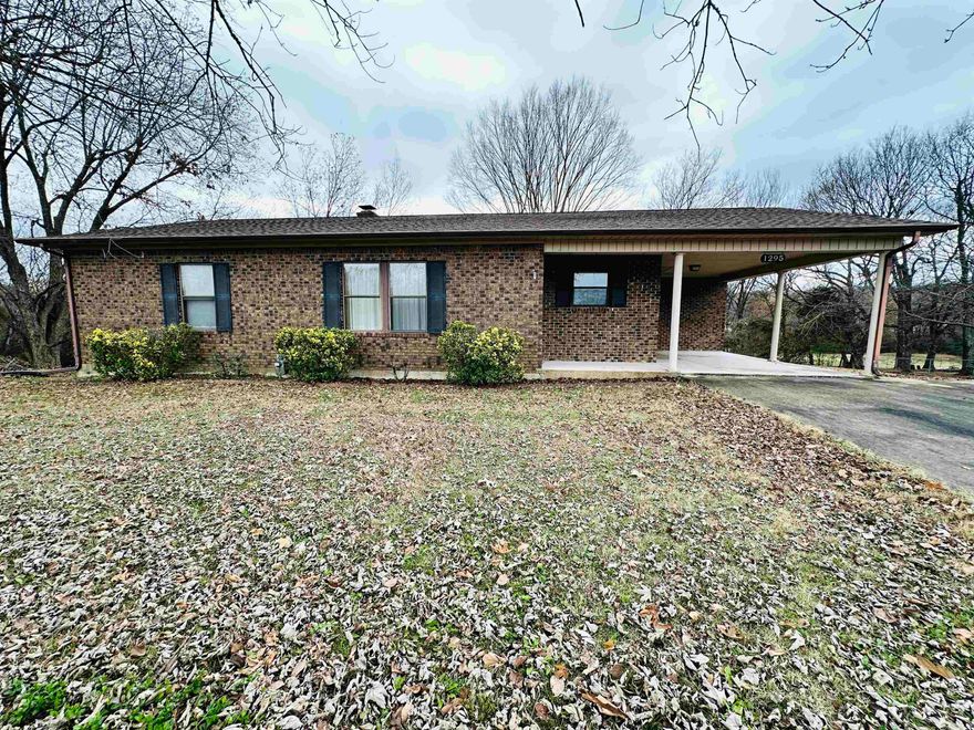 Welcome to market 1295 Elm St. in Black Rock Arkansas. This custom built and efficient 2 bed, 1.5 bath brick home sits on a large 1.44-acre lot and sits well off the road. Stepping inside the home from the front door, you will find a large living area with large windows for an abundance of natural light. The kitchen and breakfast area boasts plenty of cabinetry and storage. Down the hall you will find 2 large bedrooms with generous sized closets and 1.5 bathrooms. Into the laundry room you will find an access onto the back deck and stairs leading to the basement. From the exterior, you will notice a new roof with architectural shingles, a spacious carport for covered parking, and a large deck around back, perfect for entertaining a large crowd or relaxing by yourself. Also, in the rear of the home you'll notice a well-designed and spacious walk-out basement, complete with a roll-up door perfect for your mower, side by side, and/or other toys. The basement is clean, dry, and well ventilated, ready for a multitude of uses! Call or text today for your private tour of this home and see if it's the right fit for you!
