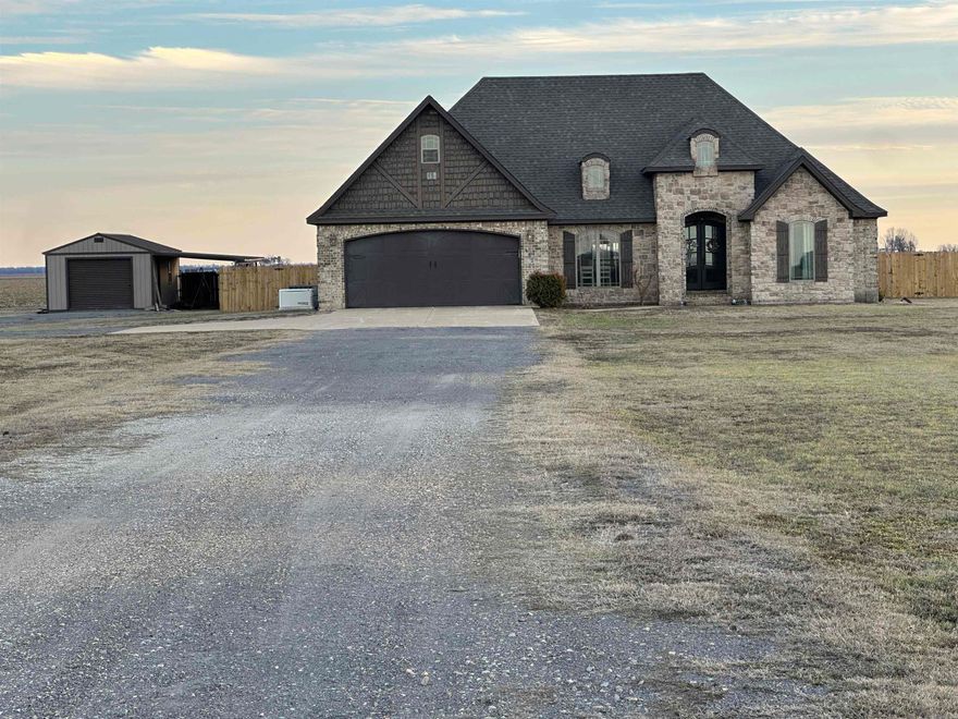 Welcome home to this beautiful 4-bedroom, 2.5-bath property offering 2,544 sq ft of comfortable living space designed for both everyday living and entertaining. Step inside to soaring vaulted ceilings, a stunning stone fireplace, and gorgeous granite countertops that add timeless style to the heart of the home. The open layout makes gatherings easy and inviting. The spacious bonus room offers flexibility perfect for a media room, playroom, home office, or a fourth bedroom. You'll love the screened-in back porch, ideal for relaxing mornings or peaceful evenings. Need extra space? The property also features a workshop, great for hobbies or storage. For added peace of mind, this home includes a built-in Generac system and a storm shelter, offering comfort and security year-round. This one truly has it all space, style, and smart features.