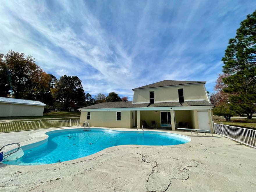 Tons of space, Acre lot, beautiful in-ground pool and 2 workshops! This home has been recently remodeled and has a new kitchen, new appliances, flooring, paint and more. There are 2 bedrooms on the main floor and up to 4 more bedrooms upstairs, or you could use it as a 4 bedroom with an office and 2nd living area. The pool has a metal fence surround. This home is located in Valley View School District. There is a driveway to the smaller shop, and it could be turned into a nice detached garage. The larger shop is built with metal studs.