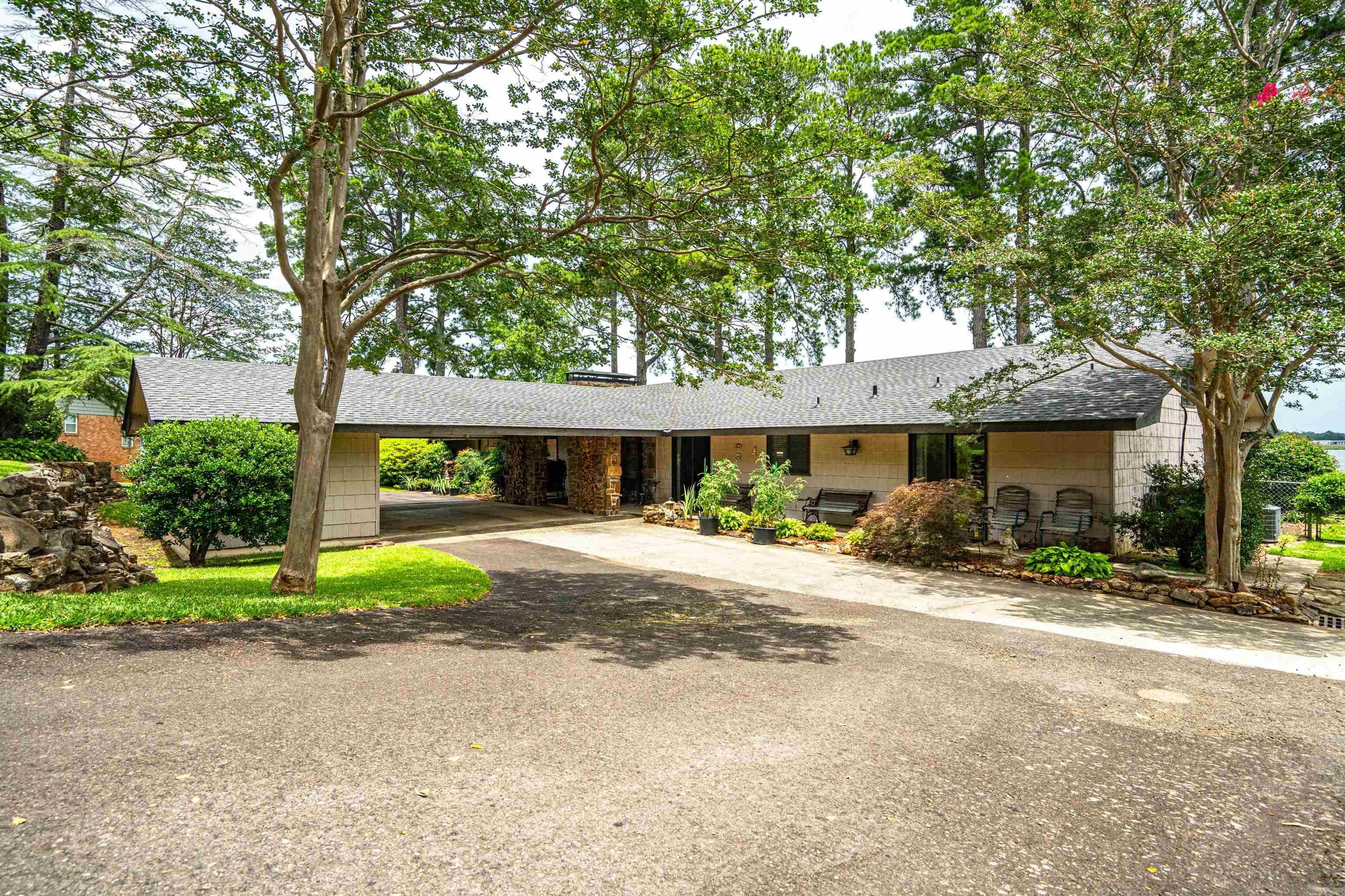 462 Caroline Acres Point has the big water view that everyone fall's in Love with. This 4 bedrooms, 3 bathrooms, 3,508 sqft+- floor plan, and spacious living areas make this home the ideal spot for entertaining on and off the lake. The patio by the water, flagstone pathways, swim dock, walk in the lake steps, double slip floating dock, all attribute to making this the perfect place to unwind and enjoy everythingLake Hamilton has to offer. Look no further for the perfect home to create lasting memories by the water.