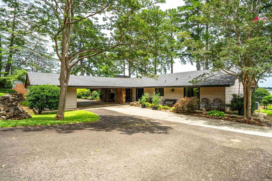 462 Caroline Acres Point has the big water view that everyone fall's in Love with. This 4 bedrooms, 3 bathrooms, 3,508 sqft+- floor plan, and spacious living areas make this home the ideal spot for entertaining on and off the lake. The patio by the water, flagstone pathways, swim dock, walk in the lake steps, double slip floating dock, all attribute to making this the perfect place to unwind and enjoy everythingLake Hamilton has to offer. Look no further for the perfect home to create lasting memories by the water.