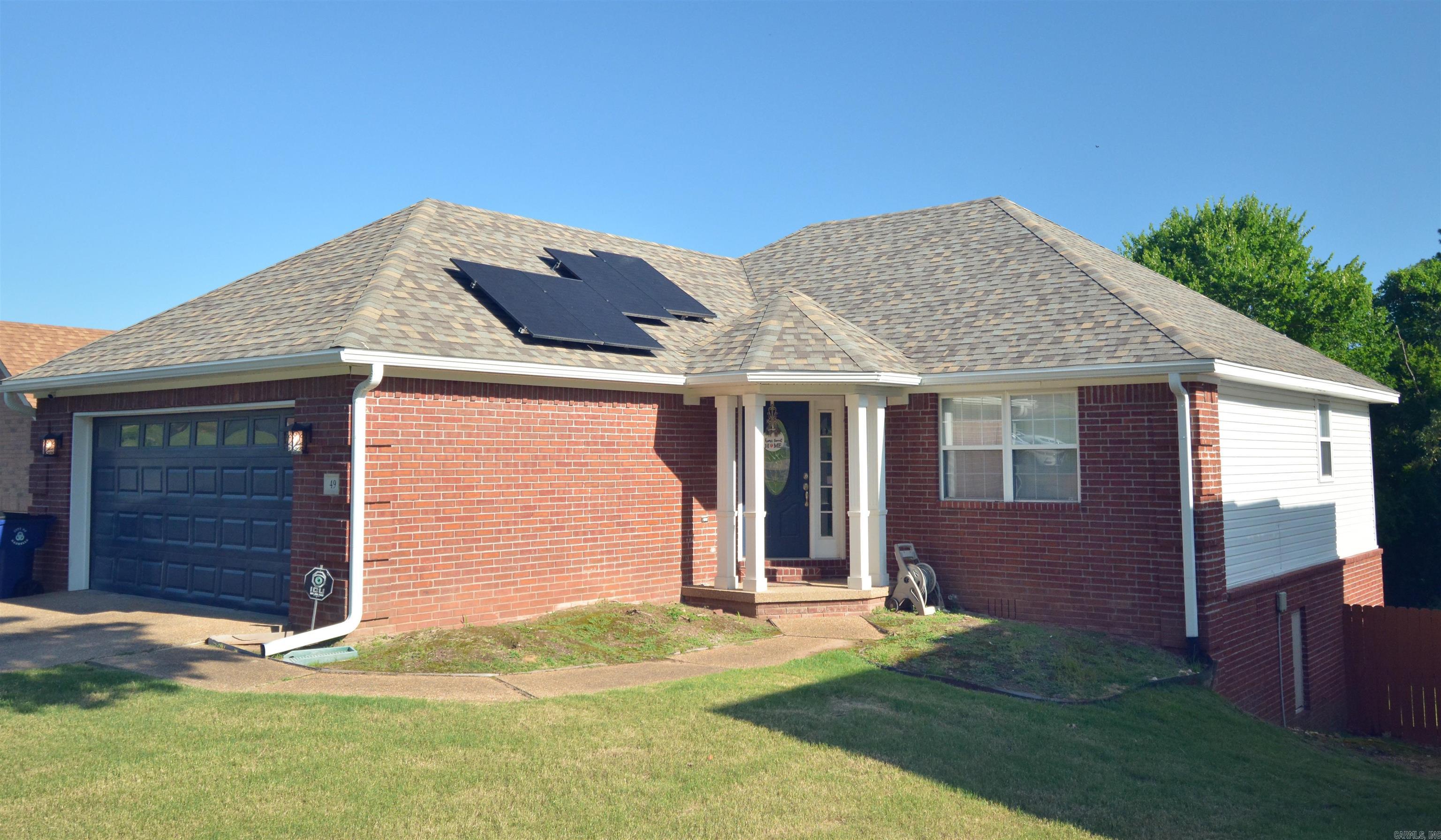 Welcome to this beautifully updated home in the heart of Maumelle! This 3-bedroom, 2-bath gem offers a spacious and functional split floor plan with fresh paint, new flooring, modern finishes throughout, and with paid off solar panels to enjoy the low utility bill that runs this oasis. The living room features vaulted ceilings and a cozy fireplace, perfect for relaxing or entertaining guests. The kitchen boasts Walnut butcherblock countertops, stainless steel appliances, and a breakfast bar that opens to the dining area. The primary suite includes a walk-in closet, double vanity, and a separate tub and shower. Enjoy the fully fenced backyard with a patioāideal for kids, pets, or weekend BBQs. Located just minutes from Maumelle Blvd, shopping, dining, parks, and schools, this home combines comfort, convenience, and style. Donāt miss your chance to own a move-in ready home in one of Maumelleās most established neighborhoods! Schedule your showing today! Solar panels paid off at closing by seller.