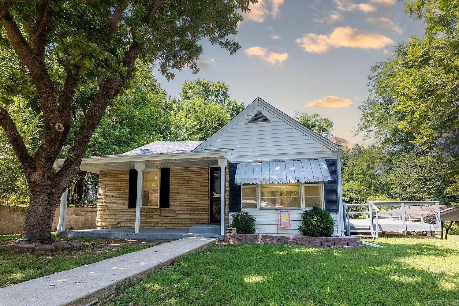 Charming Home on a Large Corner Lot ā Just Blocks from Spring River! Nestled on a beautiful 0.5-acre corner lot, this inviting 3-bedroom, 1-bath home is shaded by mature pecan and oak trees, offering a park-like setting perfect for outdoor enjoyment. Inside, you'll find a well-maintained older home full of character, with 7 total rooms including a spacious living room, dedicated dining area, and a fully equipped kitchen with all appliancesāincluding propane cook stove and water heaterāwith the propane tank conveying. Enjoy central heat and air via heat pump for year-round comfort. The full walk-out basement, once used for car storage, provides great space for hobbies, storage, or future finish work, while the attached carport adds convenience. Just 9 blocks from Spring River and Mammoth Spring State Park, this home offers easy access to fishing, swimming, and outdoor fun. Whether you're searching for a forever home, vacation spot, or rental opportunity, this gem delivers charm, shade, and location. Offered at $150,000.