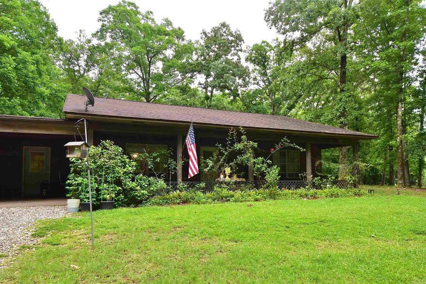 Welcome to 2736 Riverview Dr in the prestigious Riverview gated subdivision of Malvern, Arkansas! Nestled on 3.54 mostly wooded acres just minutes from the Ouachita River, this unique 3-bedroom, 3-bath home offers the perfect blend of privacy, space, and convenience. Located only 3 minutes from Ouachita River Whitewater Park and 6 minutes from Walmart, you can enjoy peaceful country living while staying close to town amenities. Inside, you’ll find open living and kitchen area featuring beautiful oak cabinets and plenty of space for gathering and entertaining. The spacious primary includes a walk-in master closet, providing ample storage. An attached mother-in-law quarters offers its own bedroom, bathroom, and living area, perfect for guests and family. Enjoy the surrounding nature from the inviting front and back porches overlooking the property. Outside, you’ll find a woodshed complete with electricity and AC, ideal for a workshop, hobby space, or extra storage. The property also features a two-car attached carport plus an additional detached carport around back for extra parking and storage. Property being sold as is. Do not miss your opportunity to call 2736 Riverview Dr home!