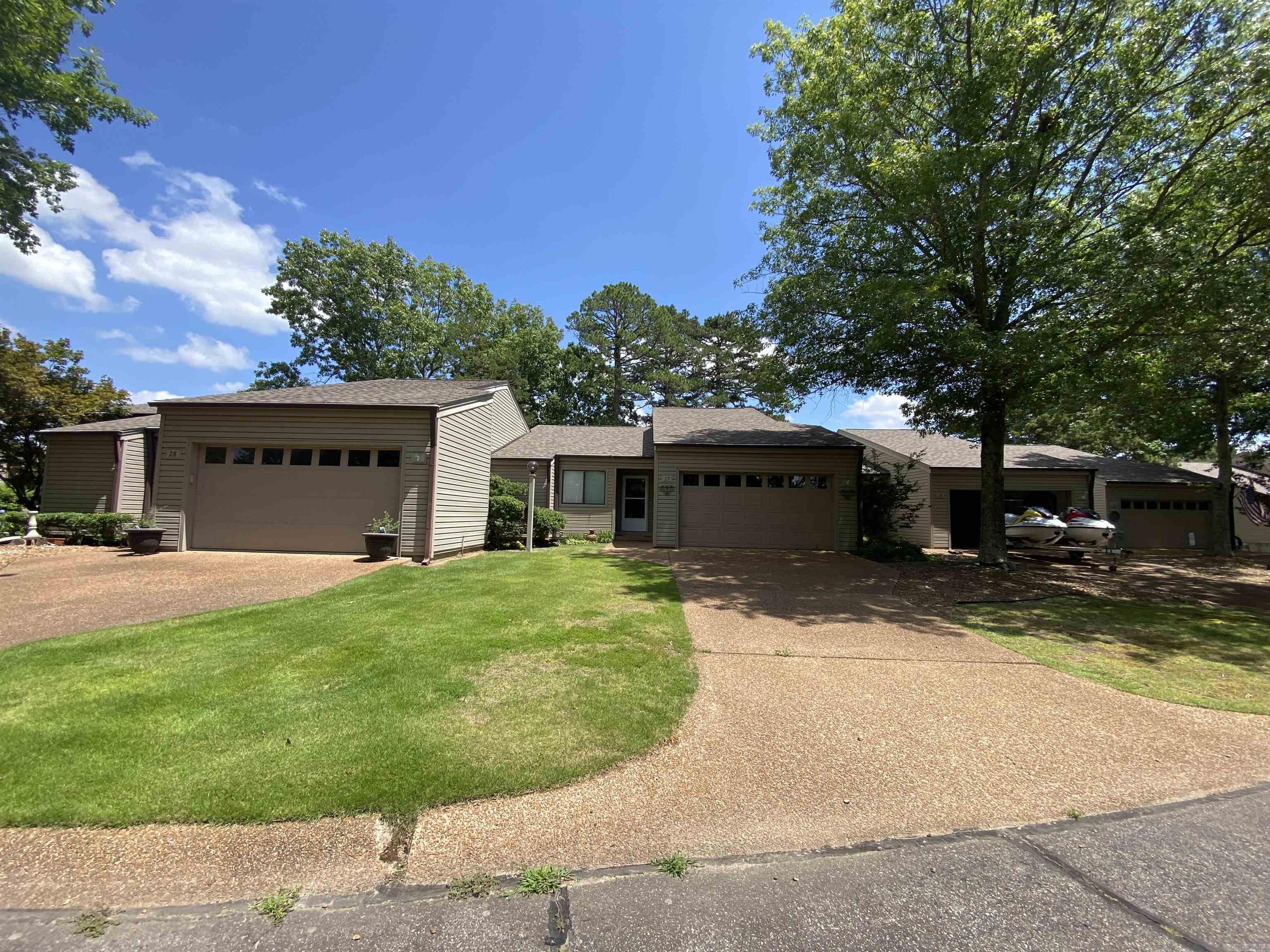Beautiful remodeled condo with a lovely view of the 18th fairway on Indian Hills golf course. The moment you drive up to this beautiful condo you will be in love with the lovely landscaped courtyard that leads you to the enclosed entry way with shiplap walls and beautiful tile floors. Then when you step into the front door you are greeted by luxury flooring that sweeps you into the vaulted ceiling greatroom with skylights, ceiling fan and a wood burning fireplace for those quiet nights at home. The cook in the family will love the galley kitchen with open bar area for entertaining, stainless appliances, farm sink, and upgraded cabinets with soft close hinges. The primary bedroom will not disappoint with upgraded lighting, his and her closets, double sink vanity with drawers and large marble shower with seat. Thats not all stepping out onto your private deck overlooking the 18th fairway you will love the solitude. Be the first to see you will not be disappointed.