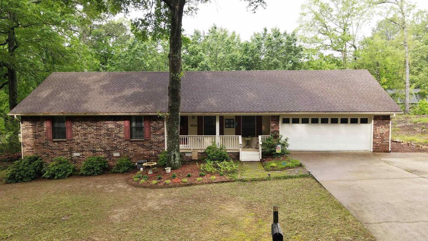 Beautiful open concept home with tons of cabinets in the large galley style kitchen.  Tankless water heater, counter tops and gas range updated in 2019.  Plenty of storage with 2 coat closets and a large linen closet. Fantastic fireplace feature with gas logs less than a year old. Large wood deck with fenced in backyard is perfect for entertaining or fur babies.  Built in storage/shop with lights and electric outlets under the house.  2 car garage with mini split a/c that could be made into another workable space and additional parking pad added to driveway. Great Location! Come check this jewel out!