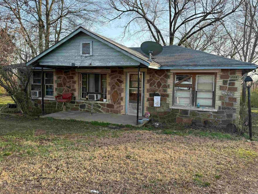 This vintage house sits on 5 legal lots.  Perfect home for remodel and rehab.  This beauitiful cut stone exterior features the best of Arkansas Limestone.    The large property has room for additional structures and income possibilities.   Home as sold as is at time of contract.