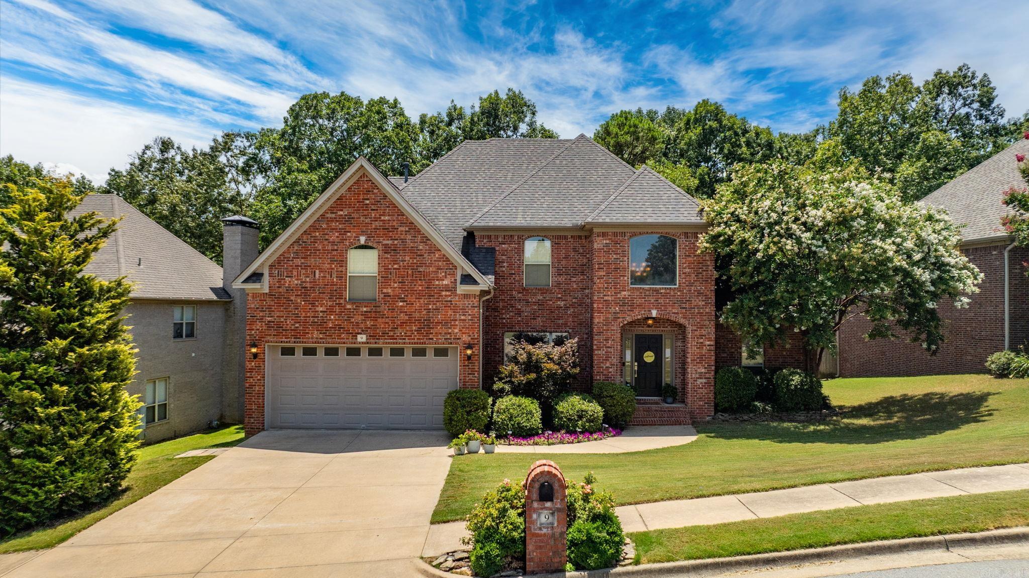 Spectacular Brick two story home in wonderful condition inside and out! Located in beautiful Woodlands Edge this home offers an exceptional floor plan and the perfect setting for family living and entertaining friends. Step inside to view the handsome two story entry, spacious formal dining and great room with soaring stone fireplace and access to sun terrace. Light filled gourmet kitchen with breakfast area. Luxurious spa inspired primary suite located on the main level with an additional guest bedroom/office and bath. Upstairs: Two large bedrooms and guest bath. Fabulous playroom/media. Fantastic terrace for grilling and enjoying the outdoors overlooking large tree shaded back yard. 2 car garage. A must see!