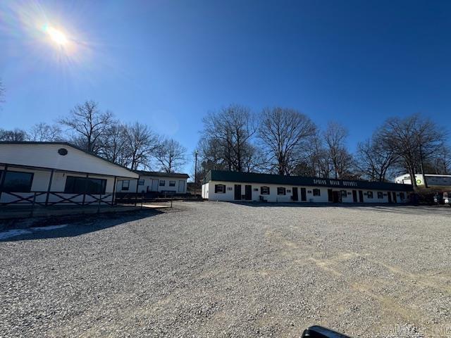 Great opportunity to own a highly visible piece of Ravenden AR! Offered for sale is the Spring River Outpost Hotel and Restaurant. This 8-unit motel is currently being offered on a month-to-month rental basis with and additional duplex on the back of the property. The crown jewel of this place is the fully equipped 2500sqft restaurant building that was once the go to stop for both locals and tourist passing through! Tons of potential with this unique property