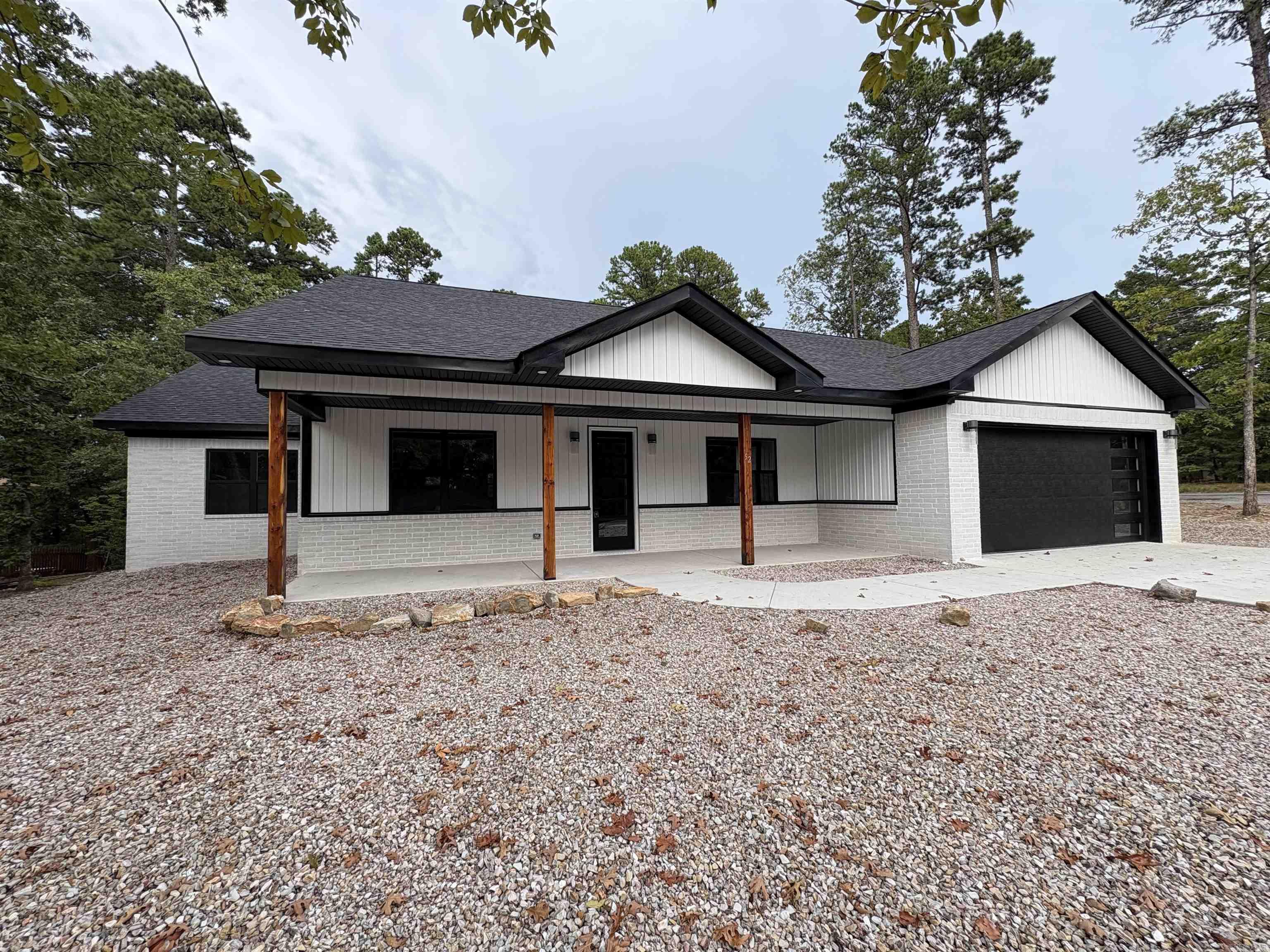 Stunning New Construction in Hot Springs Village! Welcome to your dream home in the heart of Hot Springs Villageāwhere modern design meets comfort, space, and resort-style living. This brand-new home offers crafted living space, perfectly suited for families, entertainers, and anyone seeking a blend of luxury and functionality. The home features 5 bedrooms and 3 full bathrooms across 2,610 sq ft of open living space. The modern kitchen boasts a large center island, sleek finishes, and a dream walk-in pantryāperfect for any home chef. The primary suite is a true retreat with a spa-like ensuite bathroom designed for relaxation. Additional highlights include a two-car garage and a covered outdoor living area, ideal for morning coffee or evening unwinding. Situated in the heart of Hot Springs Village, this home places you minutes from top-rated golf courses, resort-style pools, pickleball courts, walking trails, and the vibrant lifestyle that makes this gated community so desirable. Don't miss this incredible opportunity to own a brand-new, move-in-ready home in one of Arkansasās most beautiful and active communities.