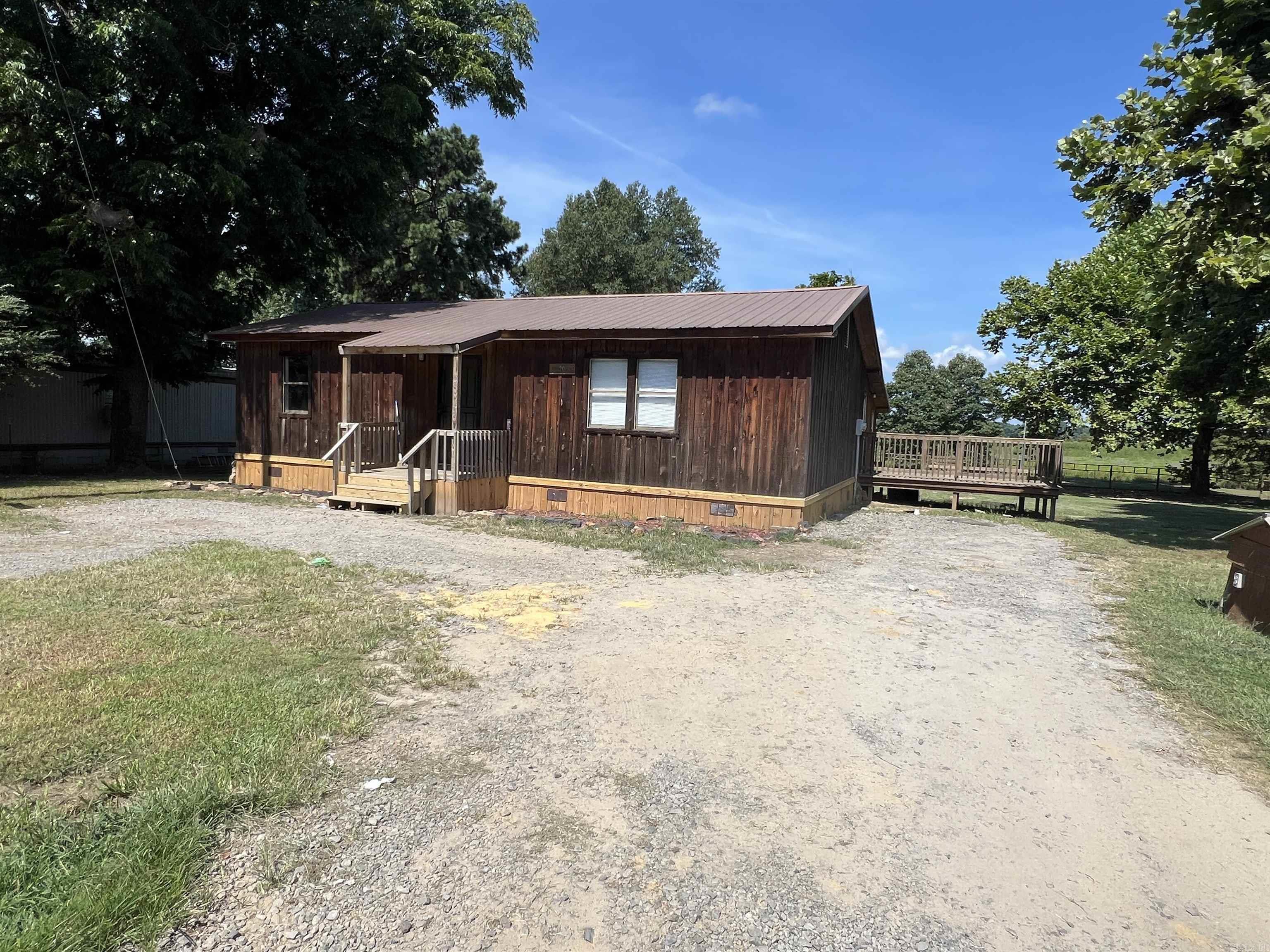 Right on Lake Conway, this home offers two lots. The home features a large living room, kitchen with eat in dining, two bedrooms and 1 bath. View the Lake from the large enclosed room on the back of the home. TO BE SOLD "AS IS".