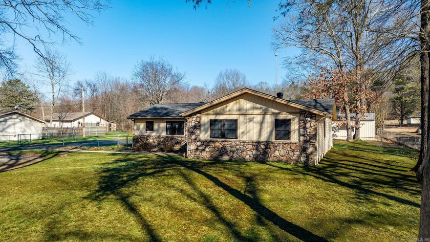 WELL-MAINTAINED + 2 SHOPS ON JUST OVER AN ACRE! A storm shelter, an above-ground salt water pool with deck + solar heating element, fenced-in backyard.... and more! Be sure to watch the video walkthrough: https://youtu.be/AuXl2hjIrqE?si=qVE--A2T00IjqiUm  Just outside the city limits, but only minutes from everything Conway has to offer, this property gives you space without sacrificing convenience. The home has been exceptionally maintained and features a spacious kitchen with an impressive amount of countertop space and cabinets, plus a large dining room perfect for gathering. The primary suite is large with a huge walk-in closet. The property sits on just over an acre with a fenced backyard, sidewalks surrounding the home, a covered back porch, and an above-ground saltwater pool complete with deck and solar heater. Two separate shops with electricity & concrete floors offer incredible flexibility for workspace or storage. There’s even a storm shelter for added peace of mind and a well pump. If you’ve been looking for room to spread out and a property that’s truly move-in ready, this one checks all the boxes. Survey on file. Roof 2018, HVAC 2015, WH 2025, Septic pumped in 2023.