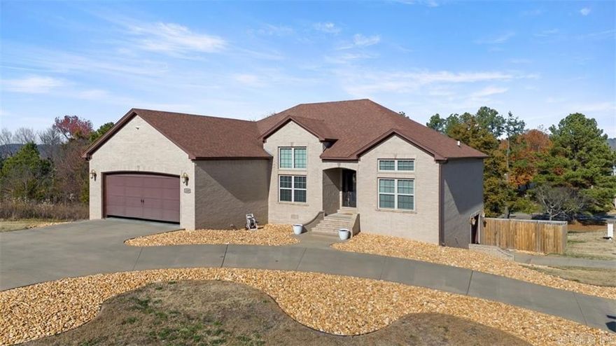 Resting in a prime location only minutes from downtown Russellville, this exquisite 4-bedroom, 3-bathroom home offers an ideal blend of comfort, convenience, and versatility. With a generous 2586 sqft of living space, this residence provides room for both relaxation and entertainment. Situated on a corner lot, the property features a fenced yard, making it perfect for families and pet owners. Entering, you'll be greeted by a warm and inviting atmosphere that flows throughout the home. The main level comprises a great kitchen, a cozy living area, and three bedrooms, including a master suite with a private full bathroom. The lower level has a versatile space suitable for use as a mother-in-law quarters, or an amazing man cave complete with a separate entrance, a full bathroom, and patio!