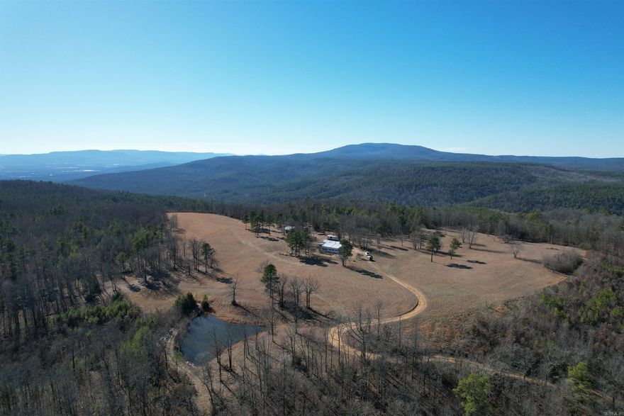 We are honored to bring you one of the last true Ozark National Forest properties privately held and managed in Arkansas. Over 205 acres more or less, referred to on the topo map as “High Point”, with firetower-like views of thousands of acres, a short runway (or deer food plot), pond and lots of timber. The homeplace sits right up top and consists of a home, barn, a well, garden space and a rock wall that is a remnant from a hundred years ago. This family has lived with this land for years and has decided to pass the torch. I won’t go on and on about the beauty of this land and its potential uses but I will say you wont beat the seclusion, privacy, wildlife and views. Own a couple hundred acres and have access to a couple thousand more. If this checks the boxes for you, give me a call!