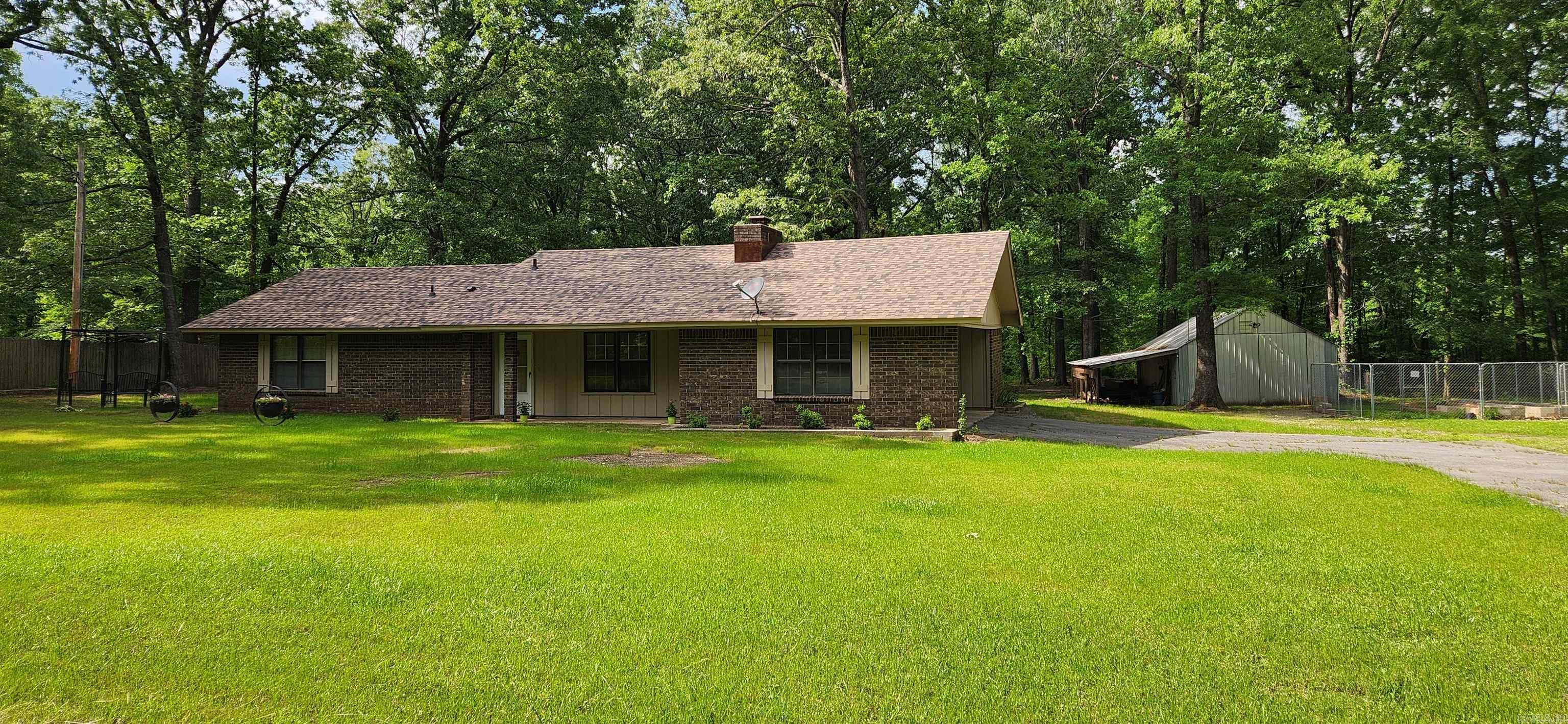 Well-maintained 3-bedroom, 2-bath home situated on four spacious lots totaling approx. 2.7 acres in a peaceful country setting. Recent updates include a new roof installed in July 2024, a covered patio added within the past year, and newer HVAC system and flooring. The cozy living area features a fireplace with a wood-burning insert. The kitchen offers a generous pantry and comes complete with appliances, including the refrigerator, washer, and dryer. Outside, you’ll find a 20x24 shop with concrete floors and electricity, plus a 12x40 lean-to for additional storage. Extra lots front out to Old Warren Road. AND property is only minutes from town. Seller will sell extra 2 lots separate.