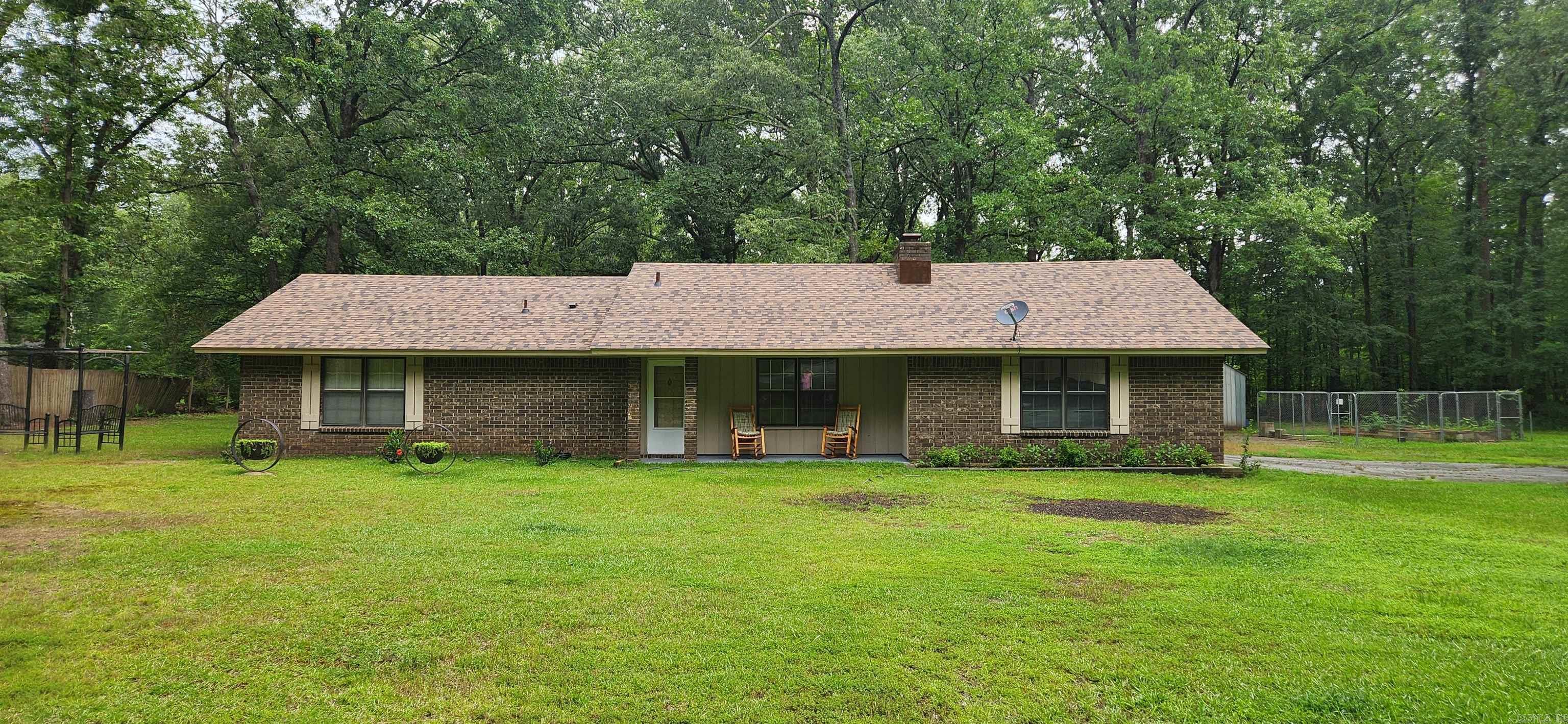 Well-maintained 3-bedroom, 2-bath home situated on two spacious lots totaling approx. 1.26 acres in a peaceful country setting. Recent updates include a new roof installed in July 2024, a covered patio added within the past year, and newer HVAC system and flooring. The cozy living area features a fireplace with a wood-burning insert. The kitchen offers a generous pantry and comes complete with appliances, including the refrigerator, washer, and dryer. Outside, you’ll find a 20x24 shop with concrete floors and electricity, plus a 12x40 lean-to for additional storage AND property is only minutes from town. There are 2 additional lots that can be purchased at additional price.