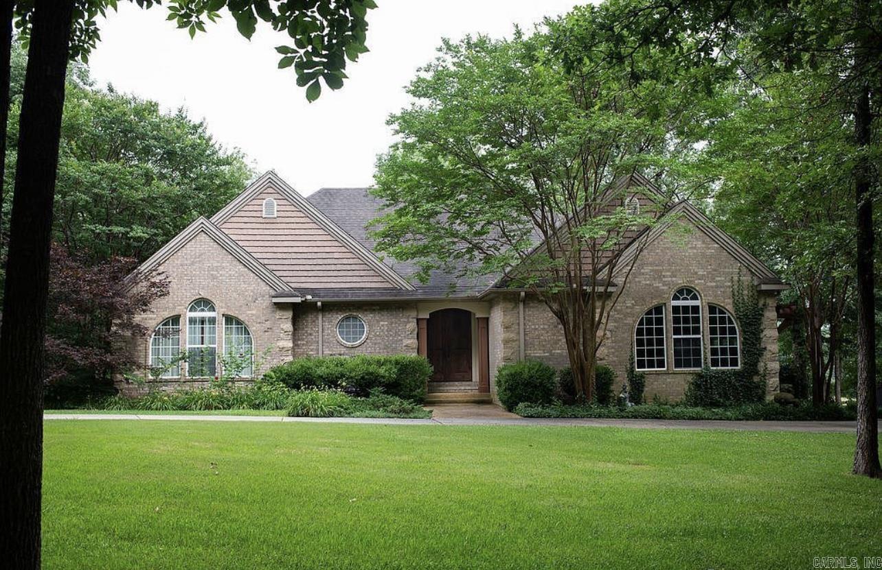 Live like you're always on vacation! This beautiful home nestled on 30 acres of wooded land has been fully updated. You will have seclusion and privacy yet minutes away from all amenities. The large deck and stone patio, overlooking one of two ponds on the property, provide a scenic setting for outdoor entertaining or just relaxing in the hot tub and enjoying nature. Inside you will be pleased with the large primary suite and bath with a large walk in closet. The open floor plan includes a spacious kitchen with beautiful quartz countertops, tile flooring, a 6 burner gas range and large living area with a wood burning fireplace, solid wood ceiling beams, beautiful Montage premium luxury wood floors, with stacked stone columns giving separation between the areas. Nature is always in view with windows across the living room and sunroom, if the sun is too bright you can easily lower the automatic blinds with the touch of a button. The lower level includes a huge bonus room perfect for hanging out, playing pool and watching TV. You will also find 2 spacious bedrooms connected with a jack and jill bathroom, 3 storage rooms and bonus room for use as an office or exercise room. Out the bas