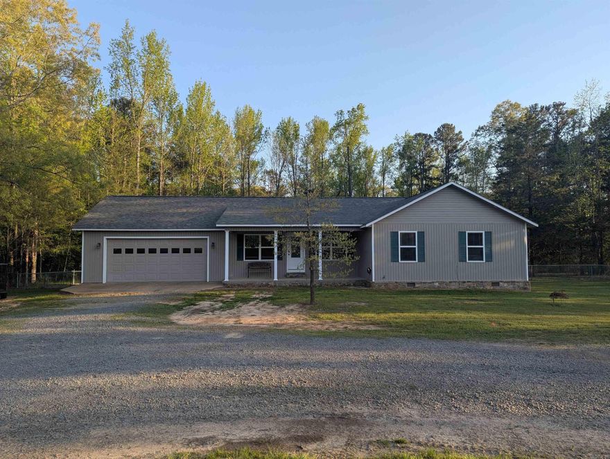 A quiet, country home with a two car garage that sits on 3 acres. This house is positioned on a paved cul-de-sac road in the heart of Greers Ferry, close to the lake and many lake marinas. This home boasts 3 large bedrooms, full size closets, 2 full bathrooms and a huge fenced in back yard with a comfortable, private back porch. Hardwood floors in all main rooms, tile in all bathrooms and carpeted bedrooms. 1/4 mile long Gravel circle driveway for ease of parking and access.  A ton of LED accent lighting inside and outside the whole home. Location is the true prize with this one. Within walking distance from the water! Lots of places to enjoy the lake and put the boat in: 1 mile from Lacey's Narrows Marina, 2 miles from Devil's Fork Recreation Area, 3 miles from Shiloh Marina, 5 miles from Sugarloaf Marina. 1 mile from everything in town: West Side School District, restaurants, gas station, city hall and more! All this close proximity to all the joys of town, while also maintaining the privacy and quietness of rural living. Come check this one out!