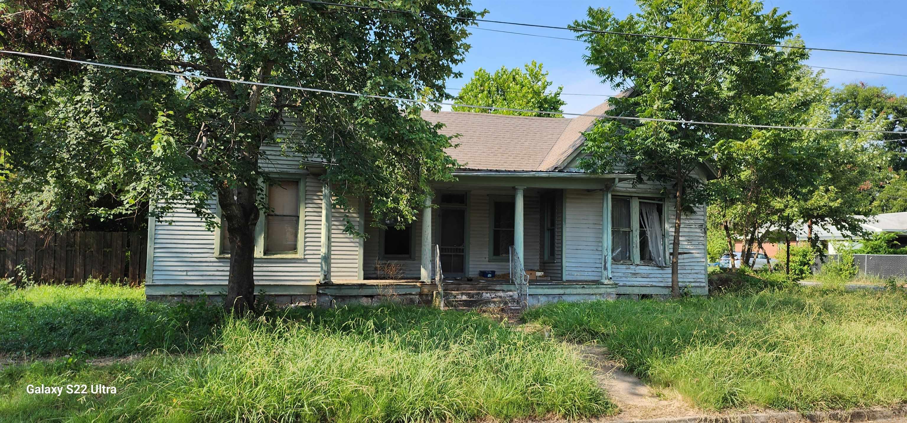 Historic fixer upper in the heart of Paris, the Gateway to Mt. Magazine State Park. Detached garage and storage building. Original hardwood floors in entry and living room. Remodel was partially started. Agents see remarks