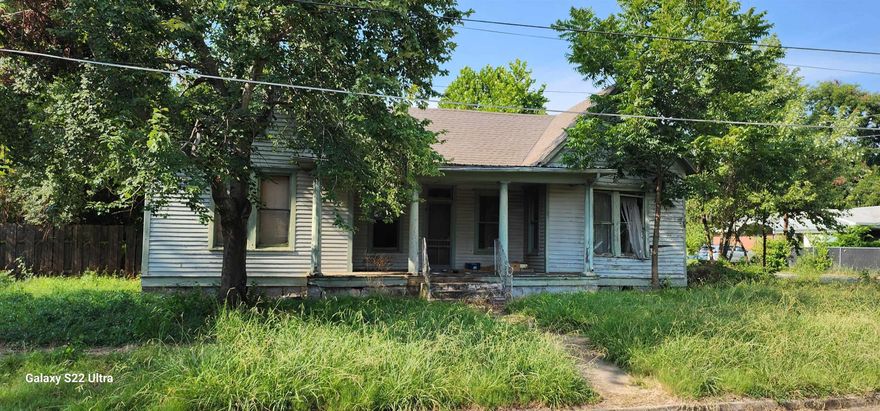 Historic fixer upper in the heart of Paris, the Gateway to Mt. Magazine State Park. Detached garage and storage building. Original hardwood floors in entry and living room. Remodel was partially started.  Agents see remarks