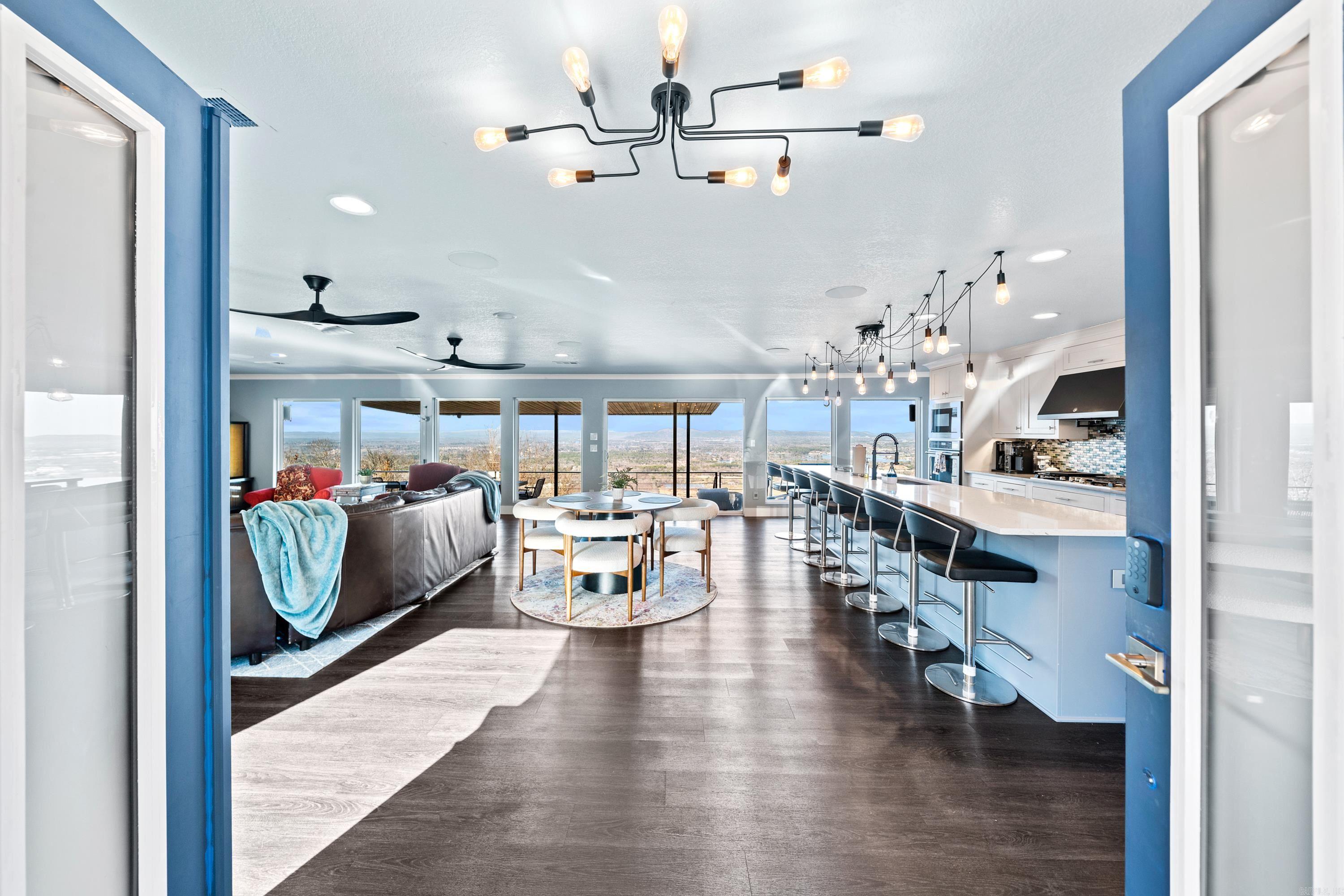 This North-Facing Mt. Riante Home features an Open Floor Plan with Walls of Glass, over 3,000sf of Well-Designed Living Space situated on 2.5 Acres with a 30x40 Shop! The Living, Dining and Kitchen Flow Seamlessly Together allowing the Chef in your Family to Take Part in the Fun! The Kitchen features a Huge Island - Perfect for Game Days, or Cooking Up a Big Breakfast with the Kiddos! It is equipped with a Gas Range, Wall Ovens and a Separate Wine/Coffee Bar. The Massive Primary Suite includes a Site-Built Stone Fireplace, Sitting Area and Beautiful EnSuite! The 1st Guest Suite also features an EnSuite while the 2nd Guest Suite has Enormous Views with the 3rd Full Bathroom located Right Across the Hall. The Home Office boasts Big City Views and is Conveniently located near the Powder Bath. Fur Baby Pawrents will LOVE the Laundry Room with its Built-In Pet Shower! The Covered Back Patio is the Absolute Show Stopper and where you will want to Spend EVERY Free Moment taking in the Views, Enjoying the Breeze and Gathering with your People! Store ALL of your toys in the 30x40 Shop Building! Call Today