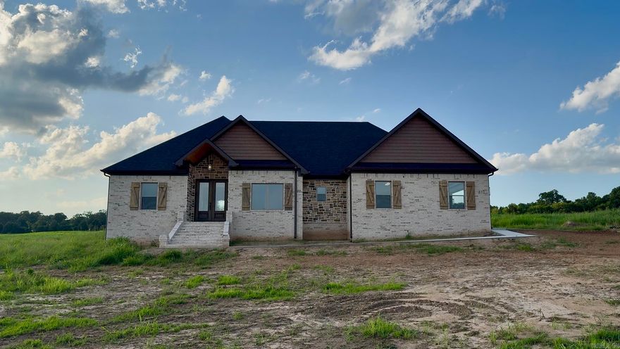 BWR Properties has done it again! The 2100 square foot home has a layout that is both functional  and spacious. The open concept common space is at the center of the home, and with the dark cabinets and fixtures contrasting the light walls and white quartz countertops, it is the perfect blend of modern and cozy.   The home sits atop the hill on just less than an acre, and the morning view from the front porch is only rivaled by the sunsets from the back porch!