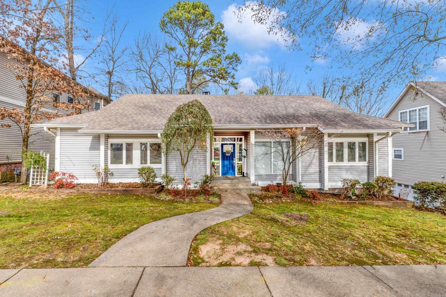 Southern “Treehouse” charm in the coveted Brodie Creek Community. Easy access to amenities in West Little Rock, nestled in a neighborhood that makes you feel like you're far from the city.  A stunning view awaits you each day, overlooking the dedicated wooded green space just beyond the backyard, where a small creek runs. The home features an upper and lower deck to enjoy the view. The main floor hosts the master bedroom with en suite bath, two other bedrooms and an additional full bath. The kitchen features stainless appliances, a built-in wine rack, and tons of cabinet and storage space. The open-concept living room and dining room, along with the floor-to-ceiling windows and vaulted, beamed ceilings make entertaining a dream.  The lower level has a large bonus room, currently used as a bedroom, with its own deck and full bath. There is plenty of room to shelter from storms, as well. The fireplace is fully gas with gas logs. The living room has a built-in 5-speaker Klipsh surround sound with a subwoofer, stereo, and receiver. The house is also wired for a generator. There is a 2-car garage with 2 walk-in basement storage areas as well as a walk-in attic area on the lower level.