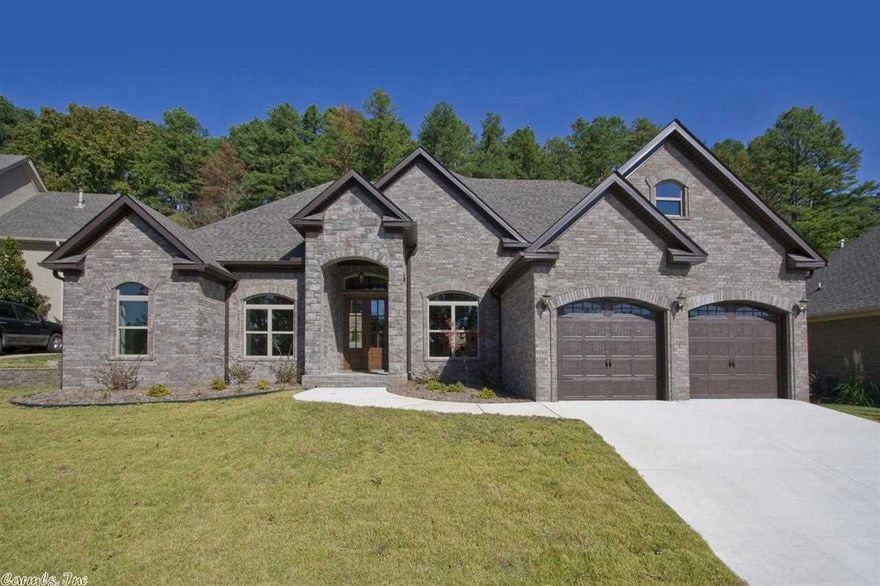 Stunning new construction with 12' ceilings in Dn Rm, Lv Rm, lots of crown molding, beautiful faux finishes, dark wood cabinetry in kitchen with 5 burner gas cooktop, GE stainless appliances, walk in pantry. Coffered ceiling in office, nice master with tray ceiling, granite in all bathrooms.  Tankless hot water heater with 10 yr warranty.  Energy efficient 14.5 seer HVAC up and down.  CCTV camera cables pulled in 4 corners.  Dummy speaker caps in media room.  Ethernet ports in media, office & living room.