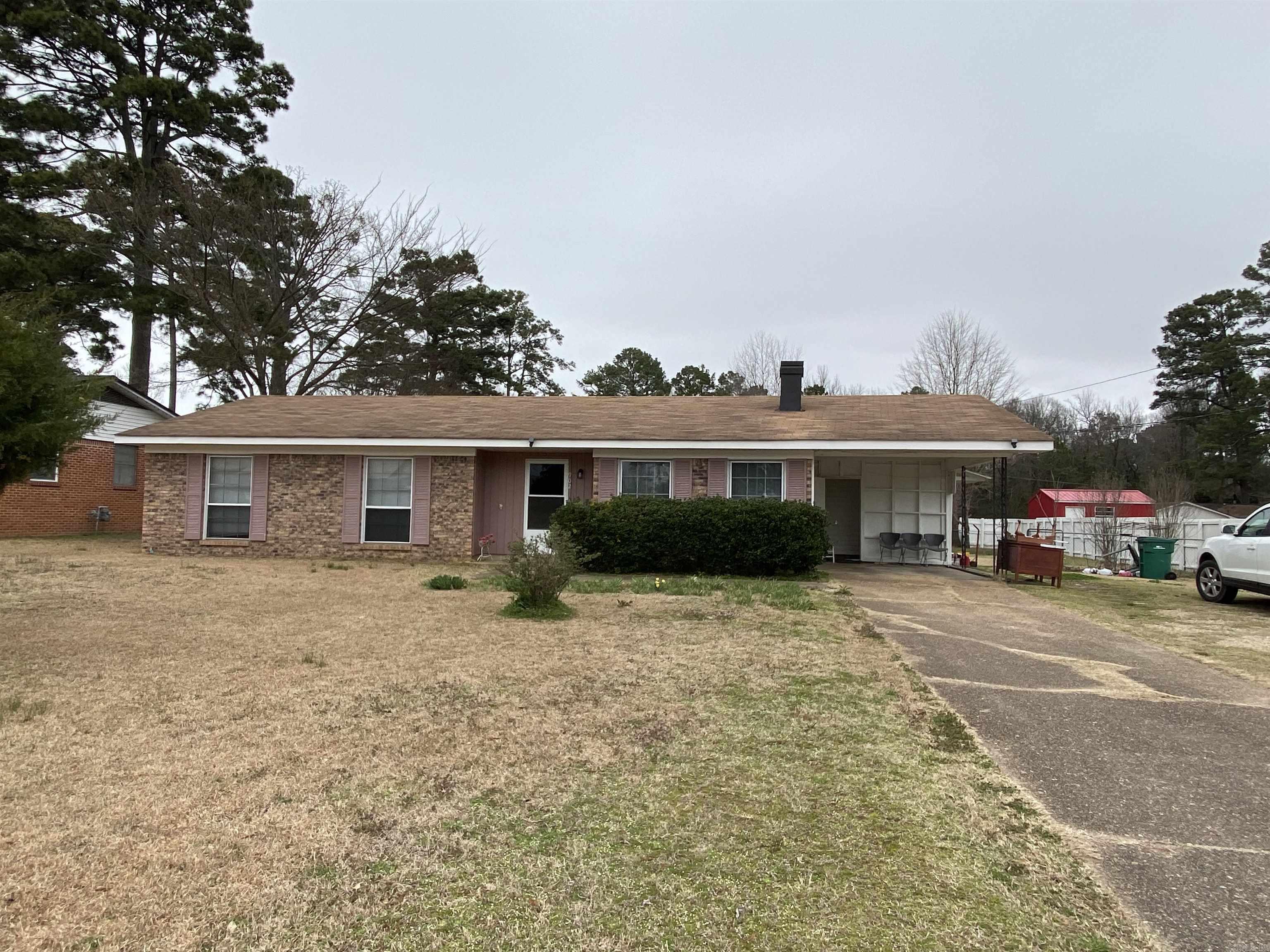 Brick home in the heart of Nashville, offers over 1,500 sq ft of living space, large living room, kitchen, den, 2 or 3 bedrooms and 1 1/2 baths. Laundry room, bonus room, single carport, chain linked/wood fenced backyard and 20x20 shop building with electricity and outside water. CH/CA, gas hot water heater and city water/city sewer.