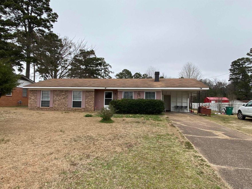 Brick home in the heart of Nashville, offers over 1,500 sq ft of living space, large living room, kitchen, den, 2 or 3 bedrooms and 1 1/2 baths.  Laundry room, bonus room, single carport, chain linked/wood fenced backyard and 20x20 shop building with electricity and outside water.  CH/CA, gas hot water heater and city water/city sewer.