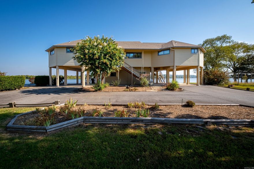 A RARE Find on the Arkansas River.  This beautiful home has 3 Bedrooms/2 Baths one level on 5.13 acres.  Stunning views of the river from almost every room.  Amazing back porch to enjoy the scenery.  Pool and a large storage room underneath with a full bathroom which is wonderful while using the pool.  Perfect opportunity to make this one your own.  SEE AGENT REMARKS