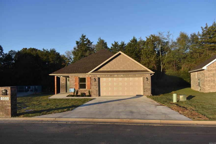 Great house with open floor plan with tall ceiling in living rm.  The home has split floor plan with nice closets. The kitchen has two different color cabinets that look very elegant The granite tops go perfectly with the cabinets. There is a large island in the kitchen as well. The house will have a large deck across the back of the house. The star of the house is the master bathroom shower with its 3 different tiles. It is a beautiful master bathroom. The laundry is large with nice tile floor and clothes rack.