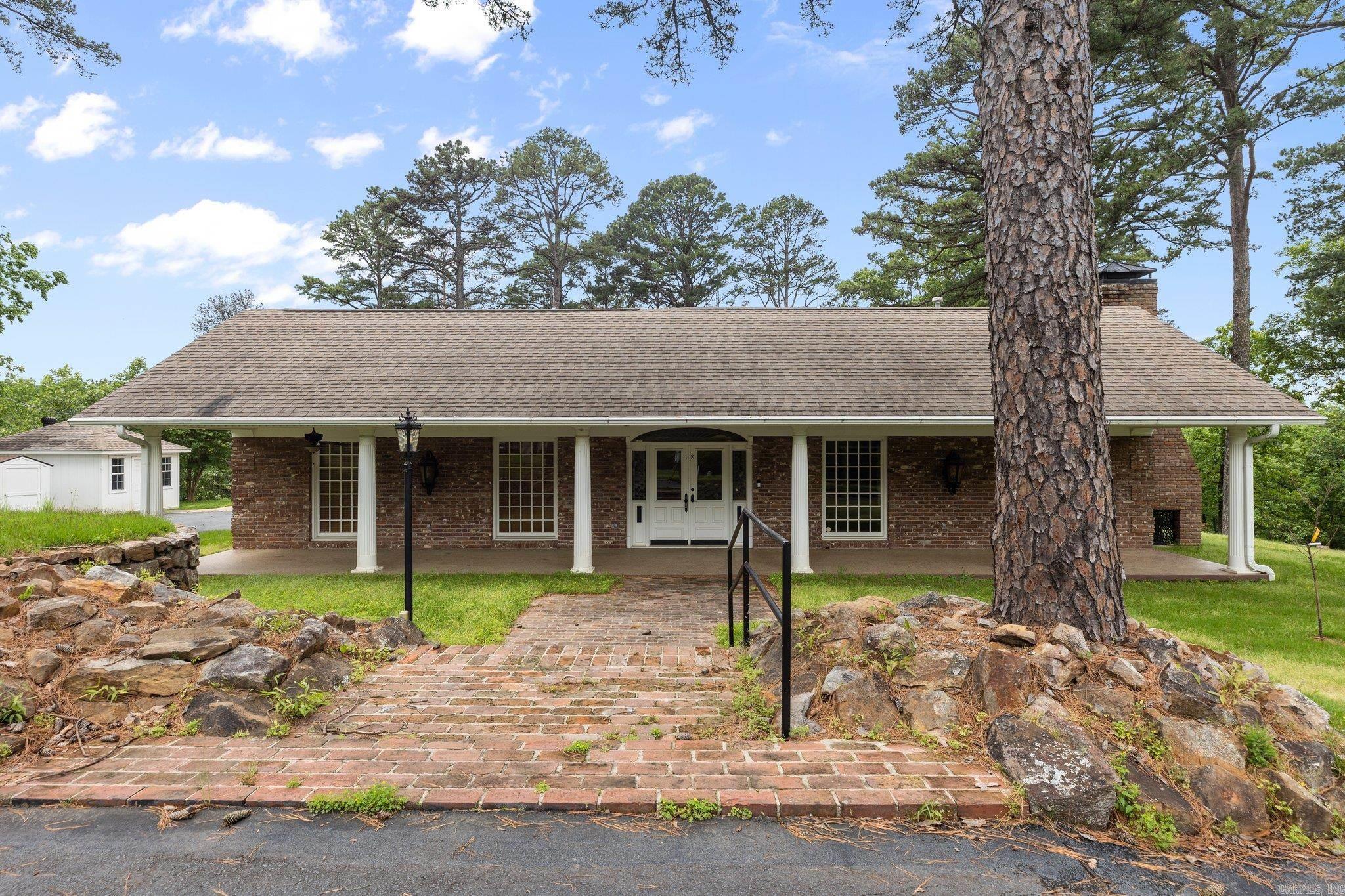 This home is a hidden gem you need to see to believe! Nestled on 1.62 acres along River Ridge Rd, it's a haven of privacy and natural beauty. This residence boasts extensive kitchen updates, featuring elegant marble countertops, charming stained glass windows, stainless steel appliances, gas stove, and stunning arched beamed ceilings adorned with skylights. Inside, you'll find ample space for every need, including an office, formal dining room, living room, sunroom, and a cozy den complete with a remote fireplace. The master bedroom and bathroom are a retreat in themselves, offering a walk-in closet, a spacious walk-in shower, and a large jetted tub for ultimate relaxation. Bonus! The whole home is wheelchair accessible. With two air conditioning units, two water heaters, and a generator, this home ensures comfort and convenience year-round. Don't miss out on the opportunity to experience the tranquility and luxury of this remarkable property—schedule your showing today!