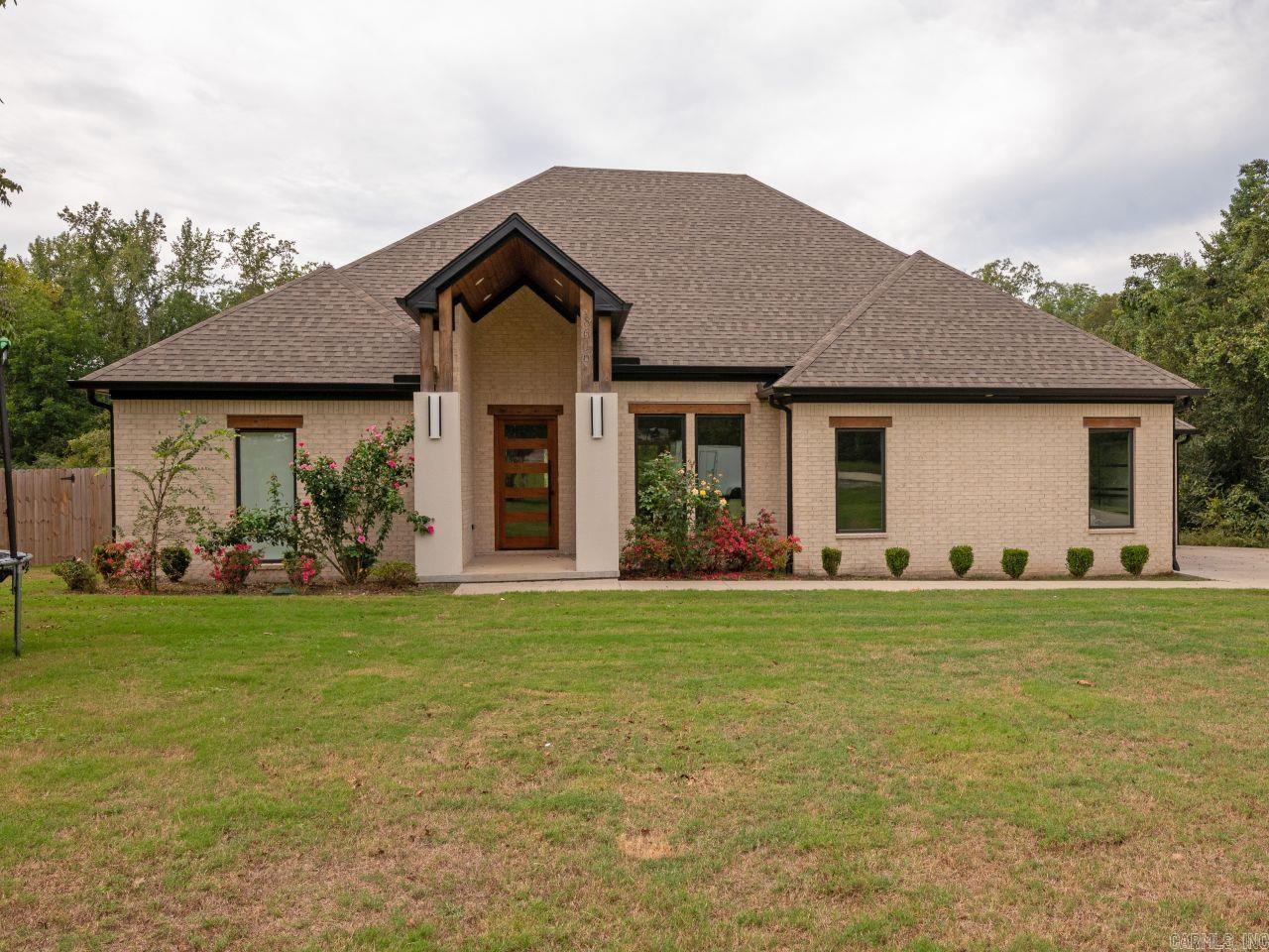 Experience refined living in this stunning one-story home nestled on 1.4 beautifully manicured acres in Benton! Boasting 5 spacious bedrooms and 4.5 baths, this thoughtfully designed residence offers the perfect blend of elegance, comfort, and functionality. Step inside to find a grand, open-concept layout , perfect for entertaining. Designed for both everyday living and upscale gatherings, the gourmet kitchen and generous living spaces flow seamlessly throughout the home. The expansive primary suite is a true retreat, complete with an enormous walk-in shower, oversized walk-in closet and a storm shelter! With a split floor plan offering privacy for family and guests alike, every room is crafted with attention to detail. Outside, enjoy the peace and privacy on the covered back porch, while the spacious 3-car garage provides ample room for vehicles, storage, or hobbies. Donāt miss your chance to own this rare gem...luxury, space, and convenience all in one extraordinary property!