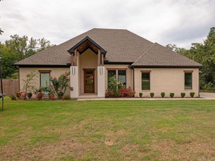Experience refined living in this stunning one-story home nestled on 1.4 beautifully manicured acres in Benton! Boasting 5 spacious bedrooms and 4.5 baths, this thoughtfully designed residence offers the perfect blend of elegance, comfort, and functionality.  Step inside to find a grand, open-concept layout , perfect for entertaining. Designed for both everyday living and upscale gatherings, the gourmet kitchen and generous living spaces flow seamlessly throughout the home. The expansive primary suite is a true retreat, complete with an enormous walk-in shower, oversized walk-in closet and a storm shelter!  With a split floor plan offering privacy for family and guests alike, every room is crafted with attention to detail.  Outside, enjoy the peace and privacy on the covered back porch, while the spacious 3-car garage provides ample room for vehicles, storage, or hobbies.  Don’t miss your chance to own this rare gem...luxury, space, and convenience all in one extraordinary property!