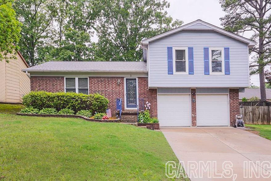 Absolute perfect location in the heart of West Little Rock! Vaulted ceiling in living area focuses attention on the wood-burning fireplace with lighted built-ins on either side. Kitchen features granite countertops with glass tile backsplash & eating area. Downstairs, the roomy laundry room/mudroom leads into a spacious game room which could also serve as a large office with built-ins. Upstairs, the three bedrooms are large with great closets. Both bathrooms have been updated with granite countertops & new lighting. Yard is spacious with tons of entertainment opportunities. Large deck overlooks beautiful landscaping with a storage shed for yard tools. Double gate in back fence allows access to backyard from street. New paint throughout HVAC replaced in 2012 Roof replaced in 2022 Hot Water Heater replaced in 2021 All new Low E Windows in 2011