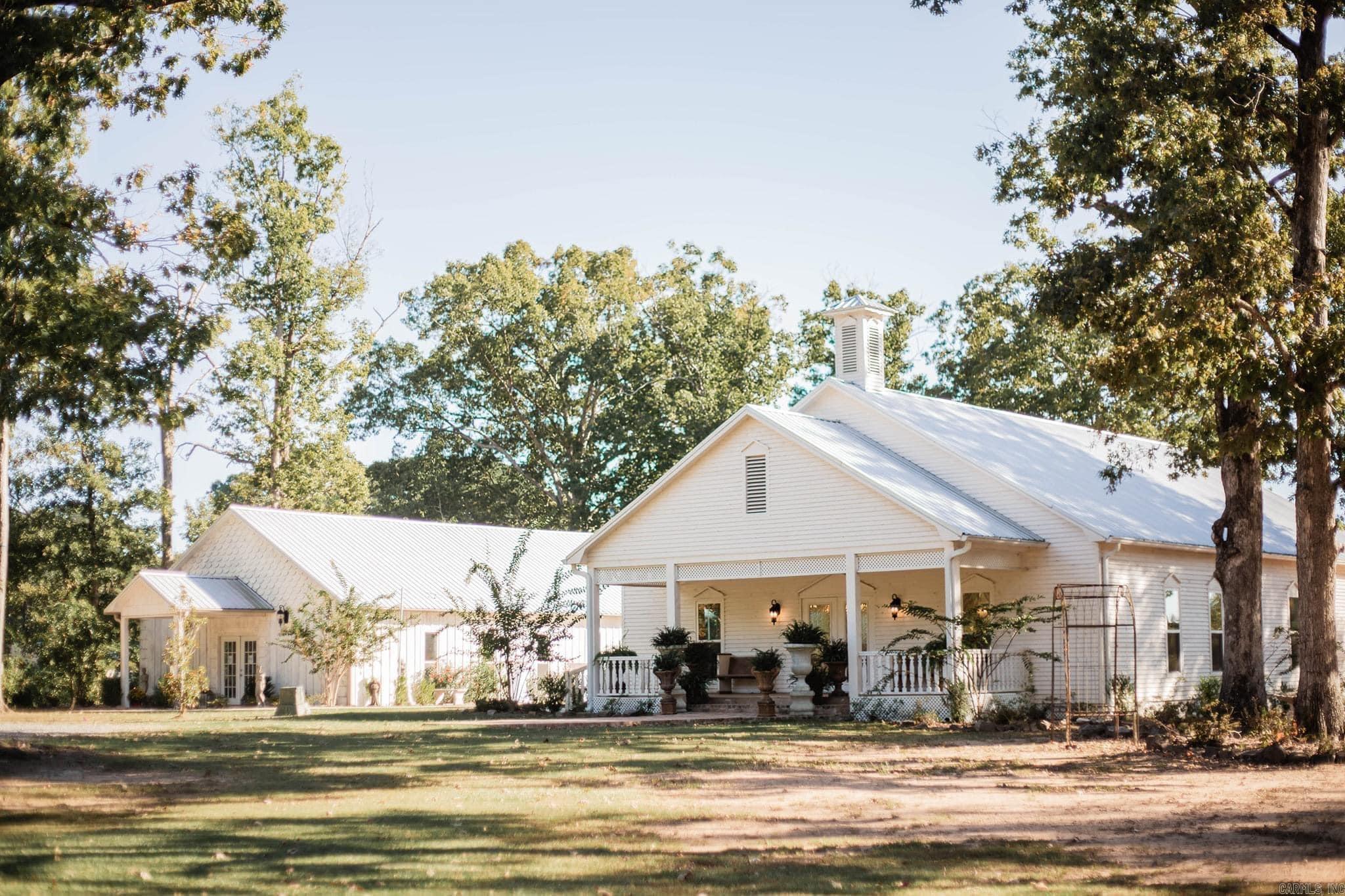 Three Buildings: The Wedding Chapel (2400 sq ft), Reception Hall (1581 sq ft), and Bride and Groom building (450 sq ft). Wedding Chapel can seat around 200 guests. Reception Hall can host 100-125 guests and includes a full kitchen and prep area. Top of the line audio system: The music system is connected throughout the Reception Hall, Courtyard, and Wedding Chapel. Bathrooms: Public bathrooms for guests. Courtyard: 30x40, perfect for outdoor events. Cypress siding on the Reception Hall, pine on the Wedding Chapel, and all 3 buildings have metal roofs. Year Built: All three buildings constructed between 2018 and 2019. All equipment stays with the property. Setting: Almost 5 acres of beautifully manicured land with a gorgeous pondāgreat for photos and the perfect atmosphere for events. Parking: Plenty of space for guest parking. Venue is designed for smooth event flow; this location offers plenty of opportunities. ALL CURRENT AND FUTURE BOOKING WILL NOT BE AFFECTED WHEN SOLD