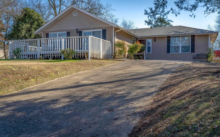Super Cute Home! Great Neighborhood Just 2 miles from Lake Hamilton School! Updated 3 bed 2 bath on 2 lots! Spacious Livingroom! Roomy bedrooms and baths. Large utility room! Great outdoor living areas with nice deck and expansive yard! Extra parking space! New Roof 2024