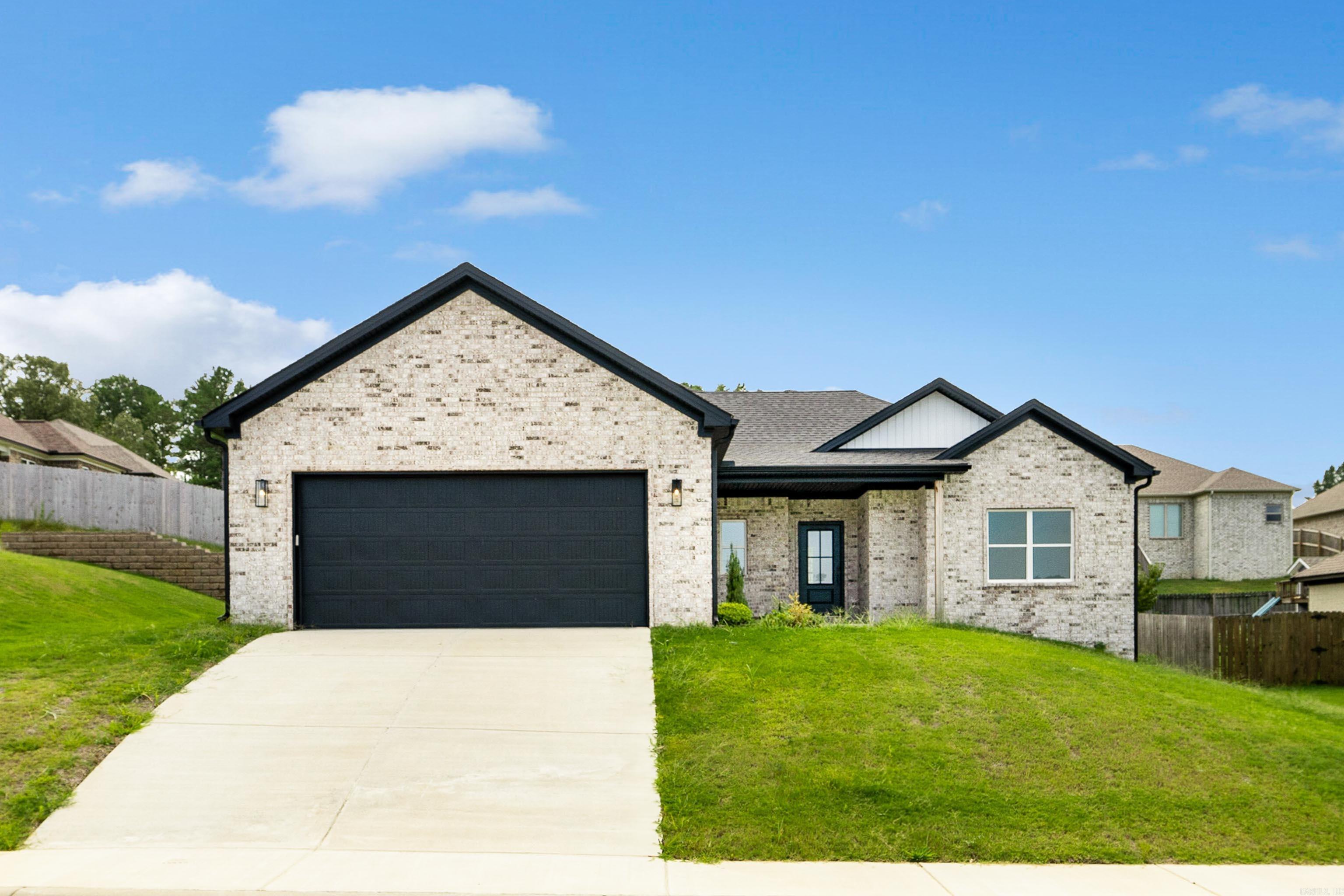 Welcome home! Step into this stunning new construction that truly has it all. From the moment you enter, you’ll be greeted by a spacious open-concept layout filled with natural light, seamlessly connecting the family room, kitchen, and dining area. The family room boasts a cozy electric log fireplace, while the chef’s kitchen is complete with a large island and a walk-in pantry—perfect for gatherings and everyday living. The primary suite is a true retreat, featuring a spa-like bathroom with a walk-in shower, soaking tub, and an expansive walk-in closet that conveniently connects to the laundry room. Evenings are best spent outdoors on the covered back patio, ideal for relaxing or entertaining. Located just minutes from the interstate, shopping, and dining, this home offers both comfort and convenience. Schedule your showing today!