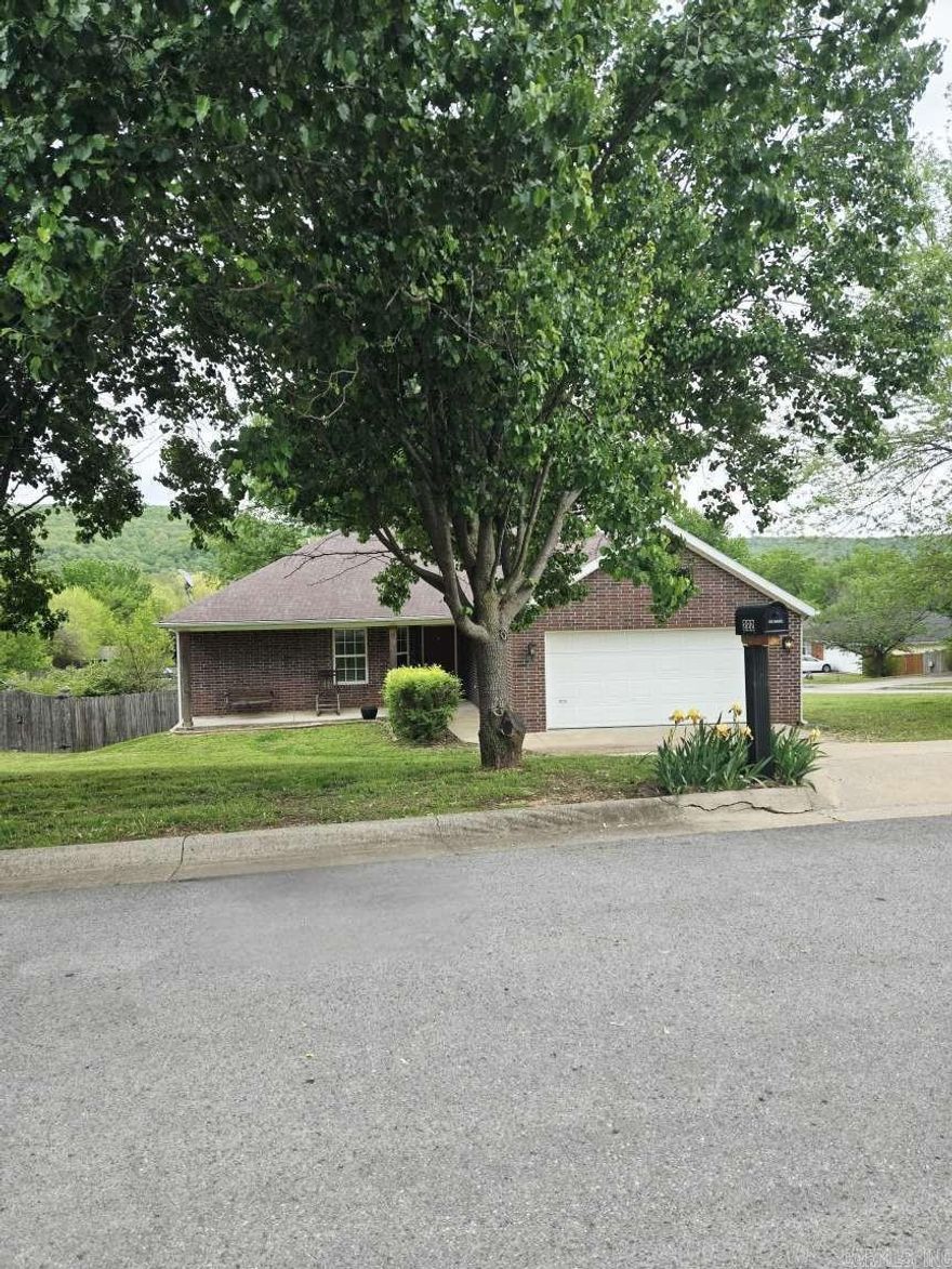 You have to see this one! This 3 BR brick home in the center of West Fork! This beautiful home is nestled in the Rivendale Valley Subdivision and it offers so much: landscaping, corner lot with large mature trees and a fenced back yard. It has a deck off the back to enjoy grilling, the scenery, or just the peaceful surroundings. The home is on a quiet cul-de-sac street within walking distance to the West Fork schools. It is 0.7mi from the local grocery store and 0.8 mi from the Interstate, 14 miles to Fayetteville, and 36 miles to Bentonville, all conveniently accessible via interstate. All of this beauty sits on approximately .195 of an acre, or 8,512 sq. ft.
