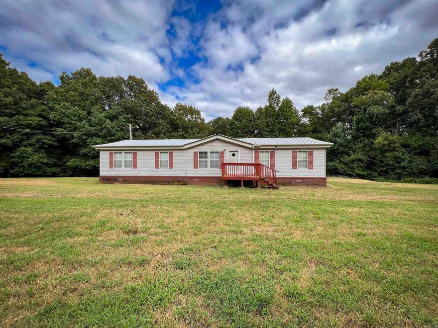 This 4-bedroom, 2-bathroom mobile home offers ample space for your family on a generous 3.15-acre lot. Enjoy the peace and quiet of country living while having the convenience of being just minutes from town.  The home features a comfortable layout with four bedrooms and two full bathrooms. While the home has great potential, it would benefit from some flooring repairs. This is a fantastic opportunity to put your personal touch on the property.  The property also includes a 24x30 shop, perfect for storing vehicles, tools, or creating a workshop. The possibilities are endless!  With plenty of outdoor space, this property offers the chance to garden, entertain, or simply relax. Don't miss out on this affordable opportunity to own your own slice of country paradise.