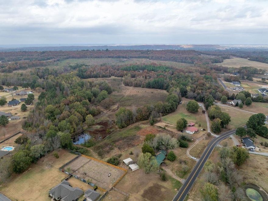This is a great opportunity to build out a subdivision on this 19 acres with an additional 7 acre lot adjoining it to the north MLS #428787. With Greenbriers award winning schools and Springhill Elementary right around the corner it is a great area. Interstate 40 is close at just 9 miles away as is Conway. Greenbrier Water, Entergy Electric, Septic needed if building multiple homes, fibre optic at road. There is an older home, shed, carport, and gameroom on site needing remodels being sold as is. You can buy this and have a large estate or build your own subdivision as you please.
