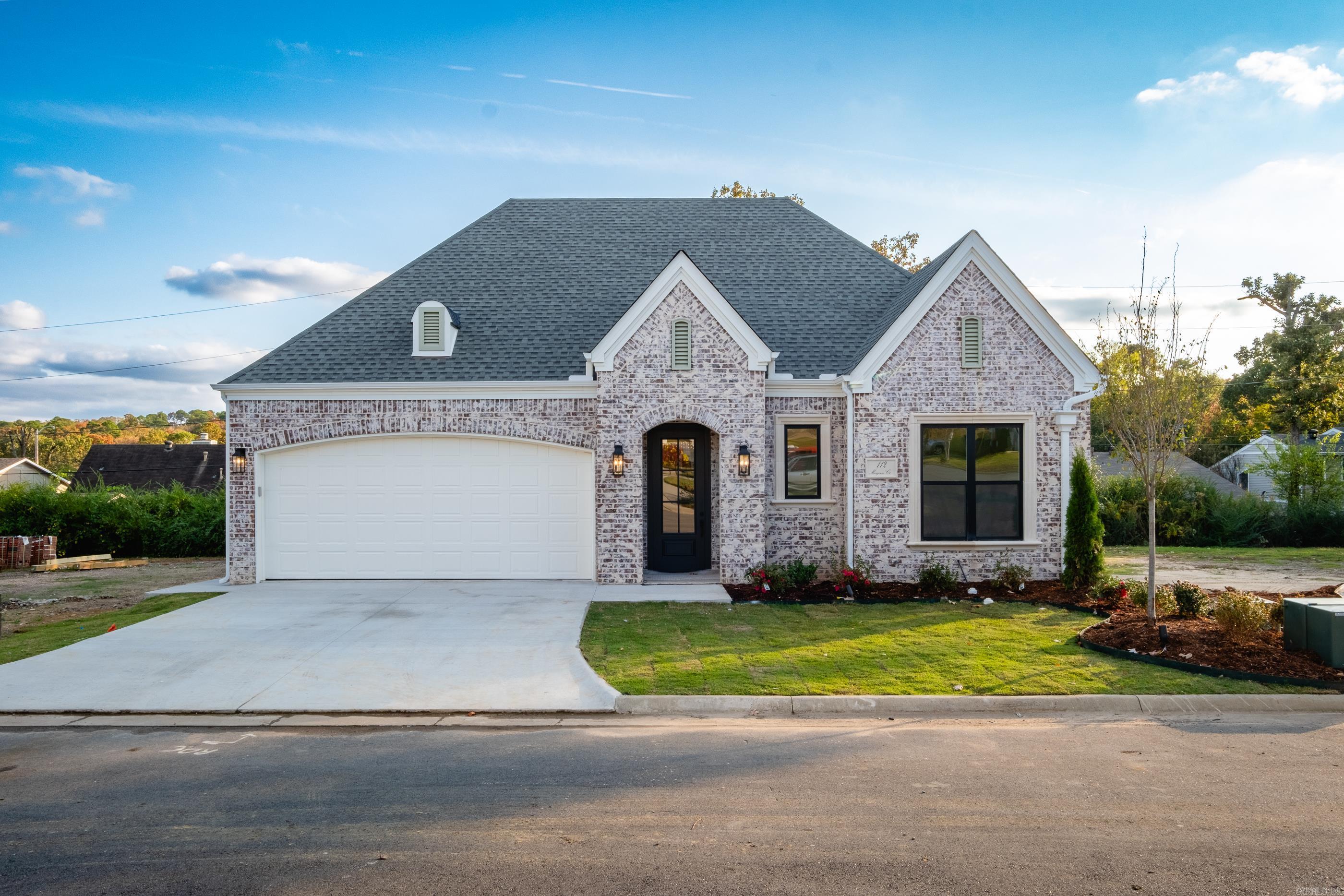 This gorgeous, all brick,1.5 level home on level lot is located in WLR and in a gated community! Enter into the beautiful foyer w/soaring high ceilings. Two full bedrooms & a full bath at the front of home. Through the foyer enter into a large great room with electric fireplace and a chef’s kitchen w/island, breakfast bar plus, custom cabinets. Stainless steel appliances, 5 burner gas range, microwave, dishwasher & pantry! Kitchen is open to a large dining area which accesses the covered patio and fully fenced yard. Beyond the living room is a separate entrance to the owner’s suite. Enjoy the owner’s spa-like bath w/large walk-in tiled shower, soaking tub & double vanity. Upstairs is the 4th bedroom/Bonus with a full bath. There is a Belvedere/Pavilion to be shared in this 13 lot European-Styled community.