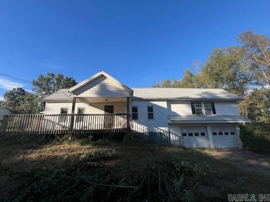 Just outside of town is this great house with acreage and square footage. There are 1732 square feet of living space. The house needs some updates and but would be a great flip for the investor or wonderful project for a move in handyman. There is a  small sun porch/room off of the galley style kitchen. There 17 x20 shop building for the person who has extra things that need stored or a place for a woodworker/handyman. 2 car attached covered parking.