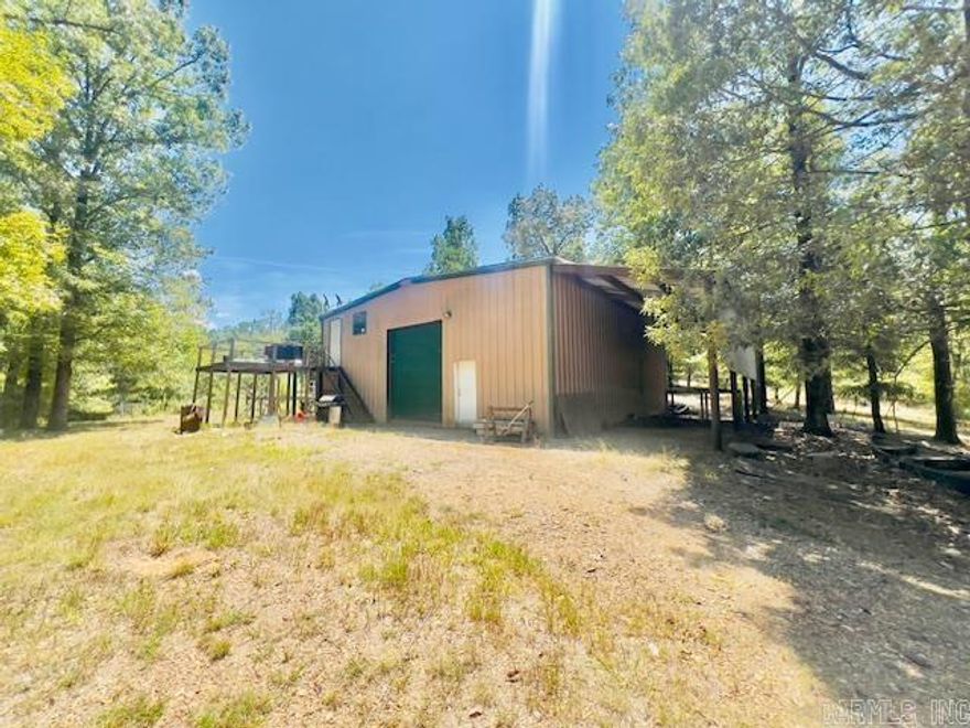 Beautiful 10 acres at the end of Evergreen lane dead end road, property is mostly wooded with a 40x40 shop, 14x40 house built inside shop offering pine walls and ceiling. Two  RV hookups on property. Large beautiful trees. Many beautiful building sites on property for additional cabins or forever home. Nice cozy apartment located upstairs. Property located on the end of dirt road, very private, approx. 90% wooded, wildlife seen on property often.  Private area.