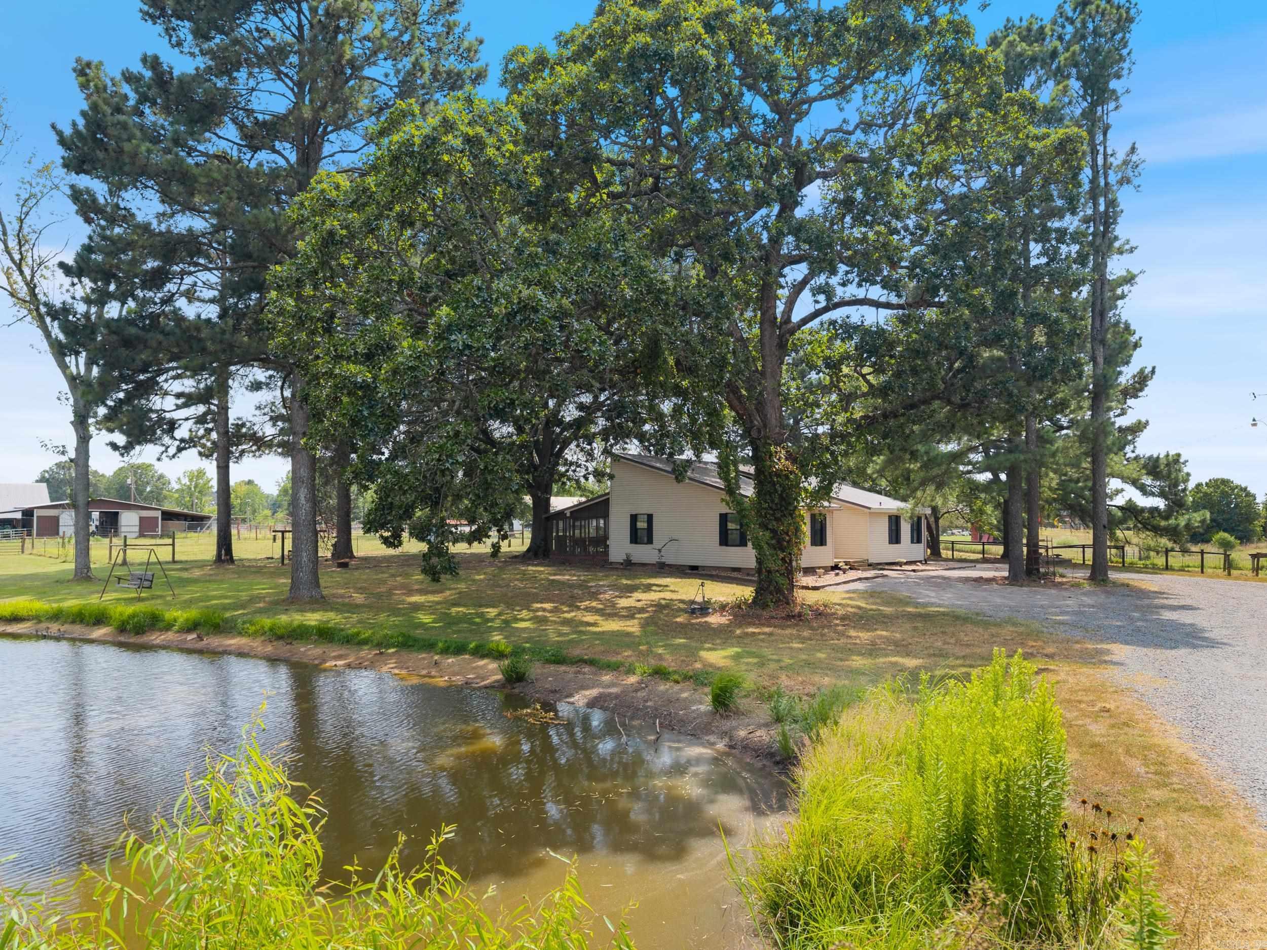 Discover the perfect blend of modern updates and timeless country charm with this beautifully renovated homestead on just under 5 acres of fully usable land! Thoughtfully upgraded in 2024, the home features brand-new floor joists and new flooring throughout the main living areas, ensuring long-term comfort and structural integrity. Set against a peaceful rural backdrop, the property offers everything needed for a self-sufficient lifestyle or a quiet country retreat. Three barns provide flexible space for storage, animals, or hobbies, while multiple fenced lots are ideal for livestock or horses. A private, stocked fishing pond adds a serene touch and invites you to enjoy peaceful afternoons outdoors. The screened-in porch is perfect for relaxing or entertaining year-round, offering a comfortable spot to enjoy the views and fresh air. Whether youāre sipping morning coffee or gathering with friends, itās a standout feature of this inviting home. With plenty of room for gardening, animals, and recreation, this non-cookie-cutter property supports a variety of homesteading goals, all while offering convenient access to nearby amenities. Don't miss your opportunity to call this home!