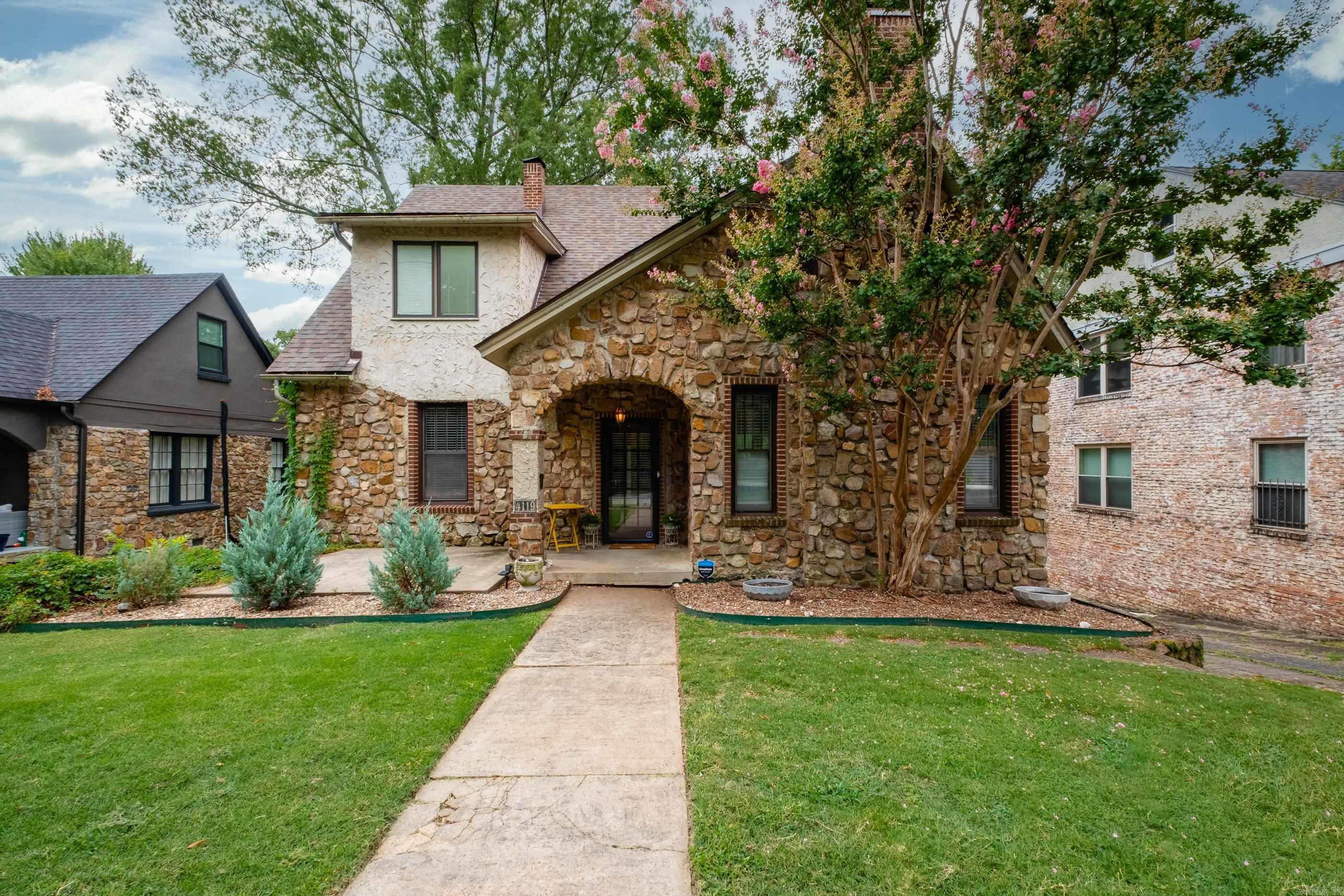 Located in the heart of Hillcrest, this charming 4-bedroom, 2.5-bath home offers walkability, character, and ample space both inside and out. Listed on the Arkansas Historic Registry, the home blends classic appeal with modern updates. A spacious composite deck overlooks the fully fenced backyard, perfect for outdoor entertaining. Recent improvements include a full kitchen remodel with quartz countertops, new backsplash, new flooring, sink, updated LED lighting, and custom open shelving. Major system updates include new HVAC, ductwork, modern thermostats, and electrical upgrade in 2024. Roof replaced in 2021. The layout features 3 bedrooms and 1 bath upstairs, a main-floor bedroom with a beautifully renovated bath, and a basement with a half bath, laundry, storage, and a 1-car garage. Parking is plentiful including 2 covered spots beneath the deck. Donāt miss this rare Hillcrest gem with space, updates, and unbeatable location.