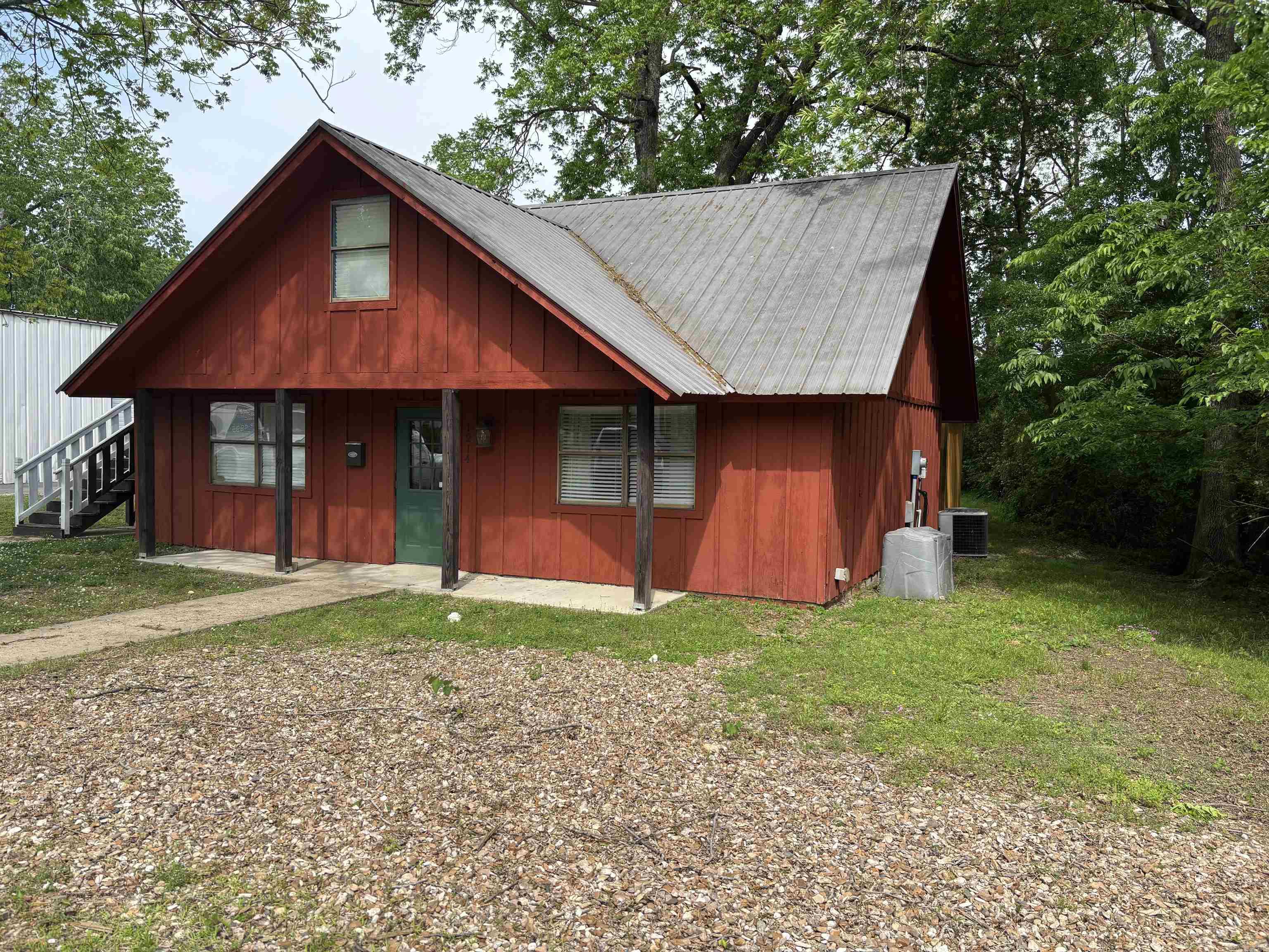 Great office opportunity! Waiting area, registration desk, offices, conference room. 660 sq ft living space upstairs. ADA Compliant, All doors have separate locks. 10’X16’ storage building in back. Would also make a great salon. Original salon plumbing still in the back wall.