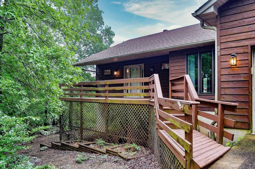 Breath-taking views and oodles of space welcome you to this custom constructed home located close to the Hot Springs Village Look-out spot.  3 bedroom 2.5 bath home is loaded with storage. Entry level hosts primary suite, laundry/pantry, dining area, living area with fireplace, half bath and 2 wonderful walk-in storage rooms. Lower level is ideal for game room with wet bar and 2 bedrooms with another full bath. There is a workshop area that enters either from the inside or outside of the home. Hot Springs Village Property Owner Association has a new member buy-in fee of $2,000.00 due and collected at closing.